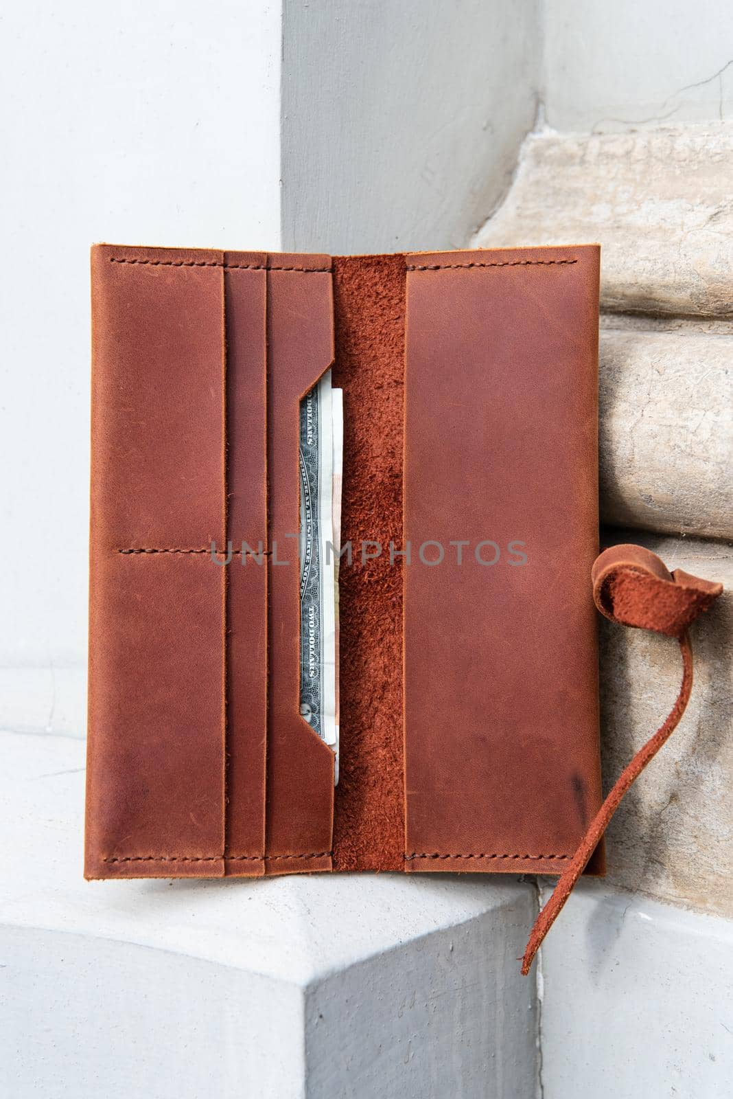 hand made leather wallet . Leather craft. Selective focus by Ashtray25