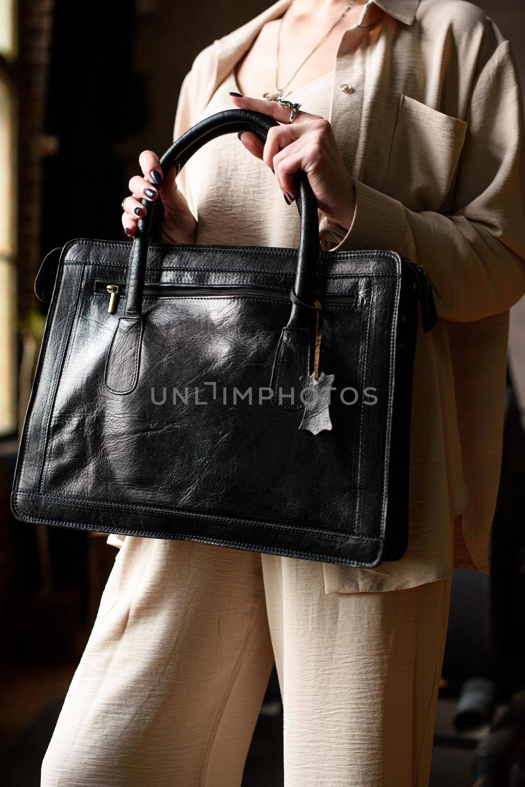 close-up photo of black leather bag corporate. indoor photo