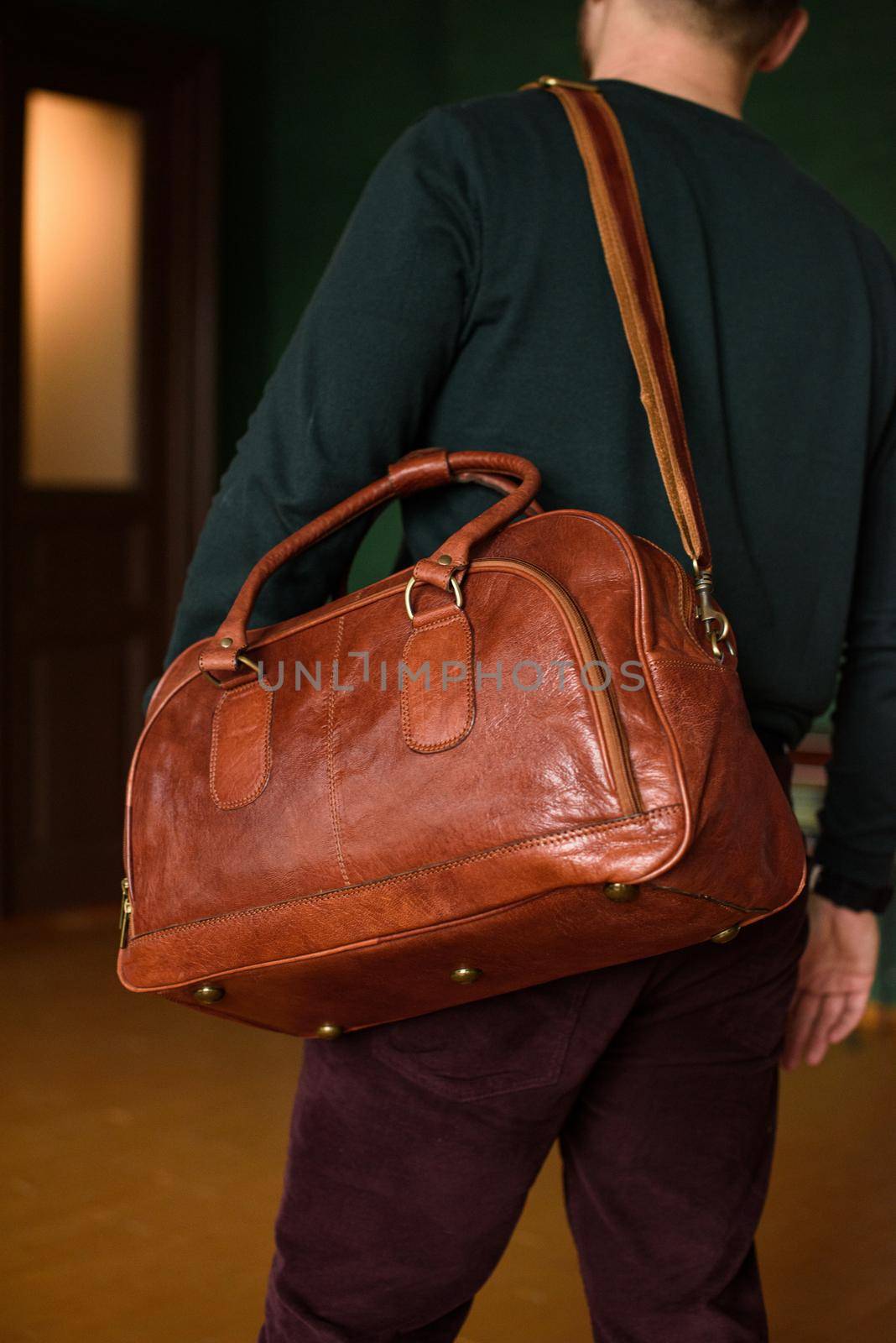 close-up photo of orange leather bag corporate. indoor photo