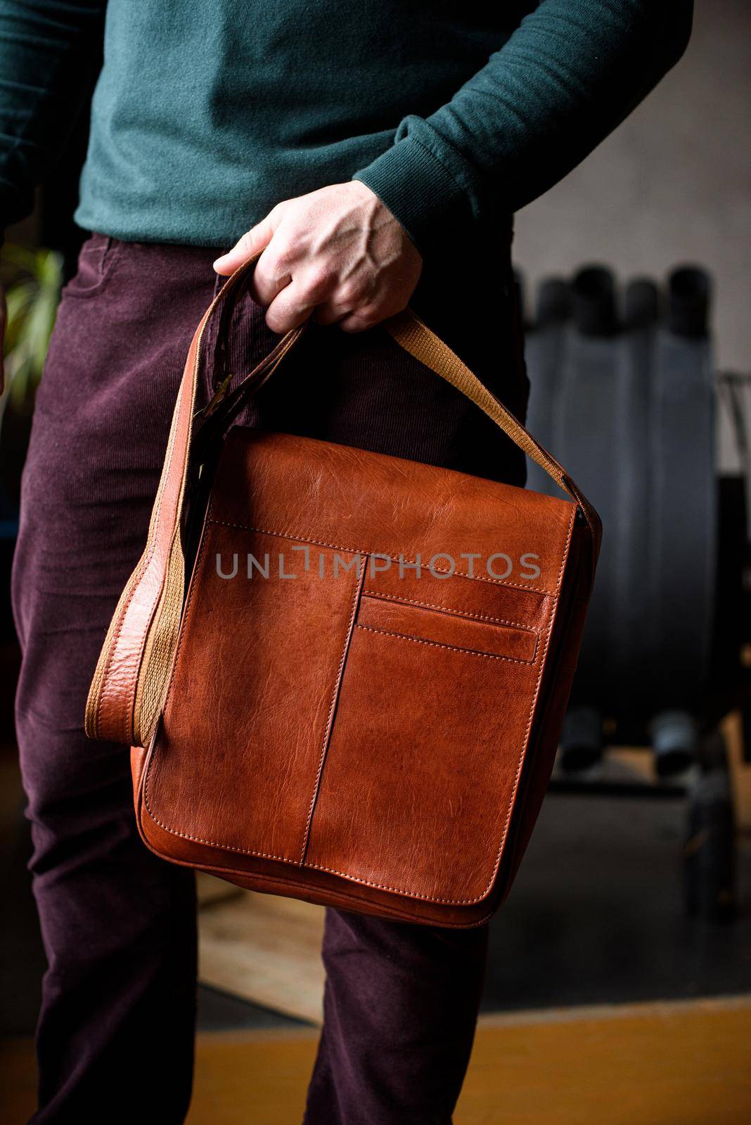 close-up photo of orange leather bag corporate. indoor photo