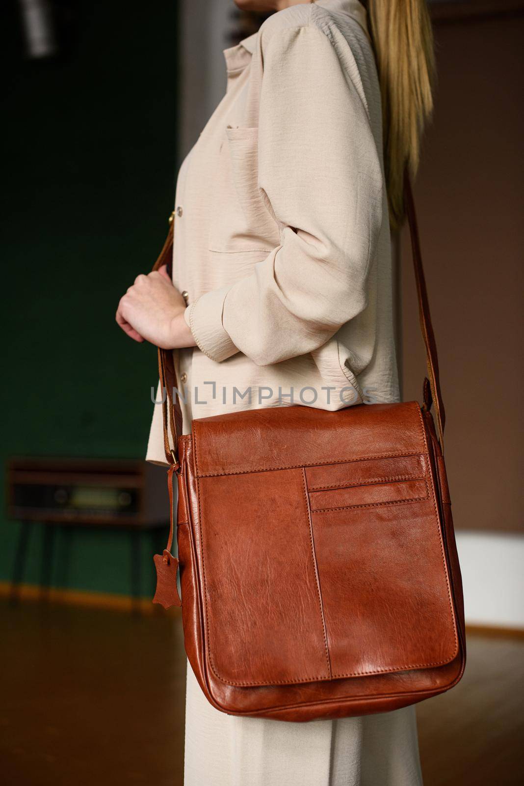 close-up photo of orange leather bag corporate. indoor photo