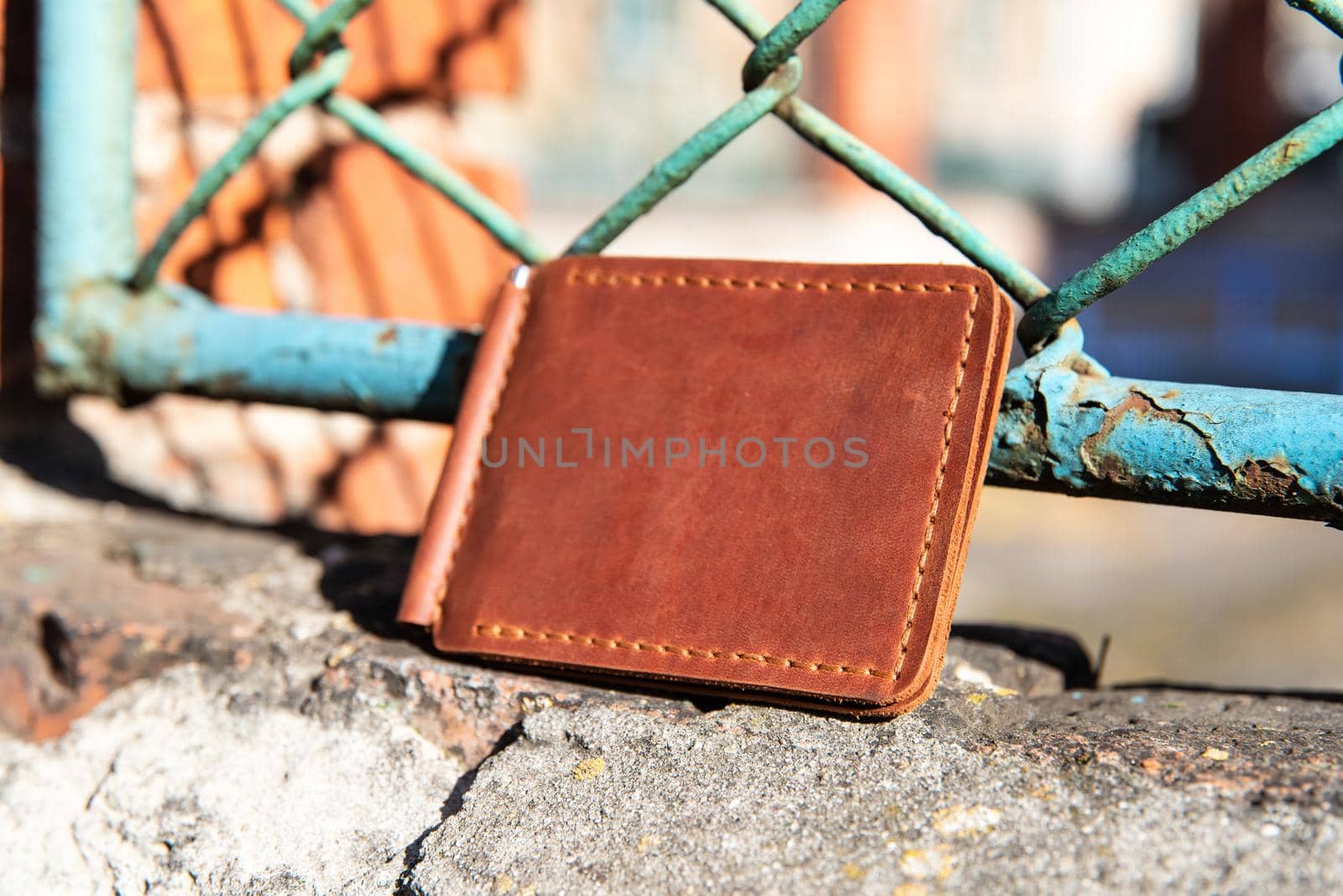 hand made leather money holder. Leather craft. Selective focus by Ashtray25