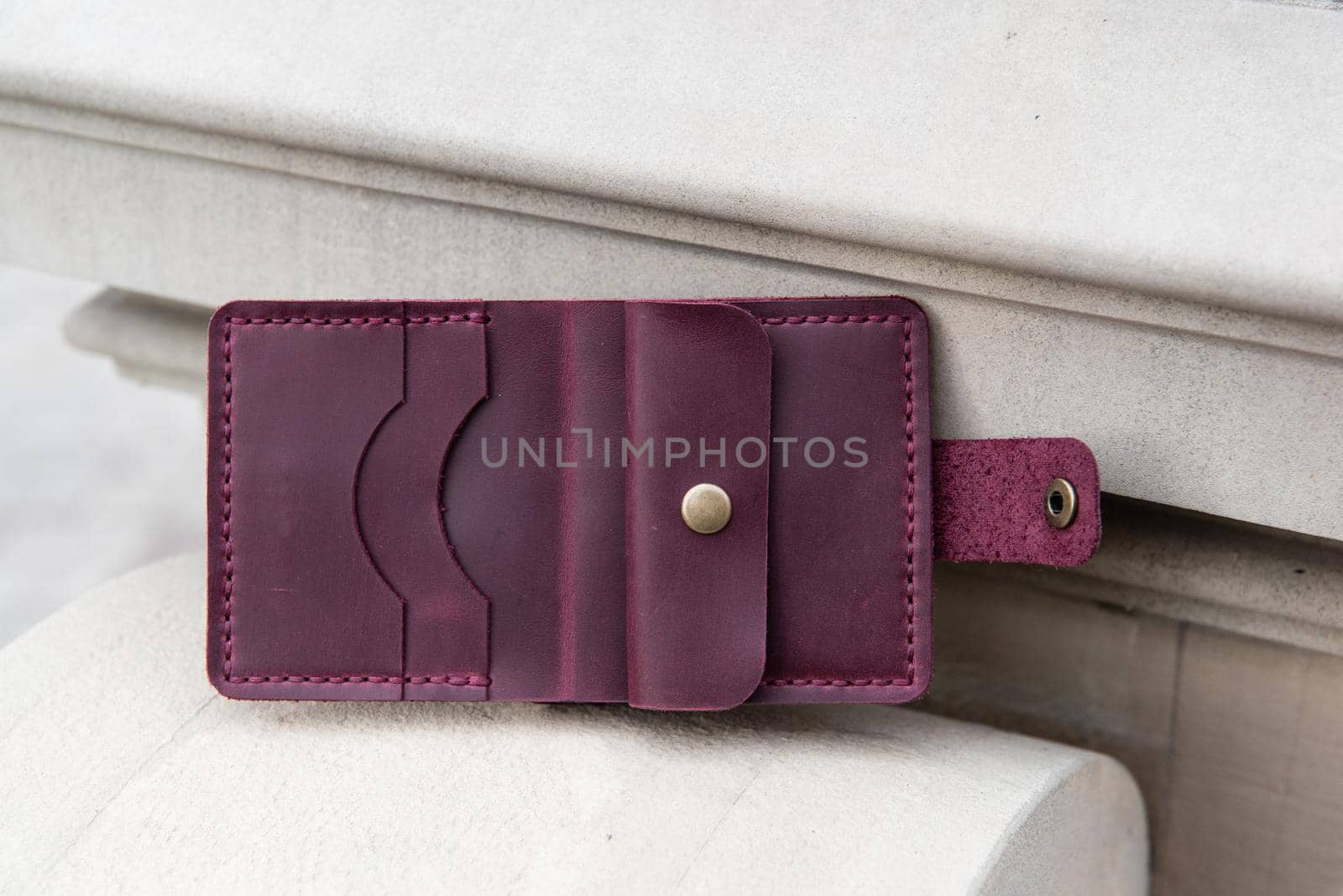 hand made leather wallet . Leather craft. Selective focus by Ashtray25