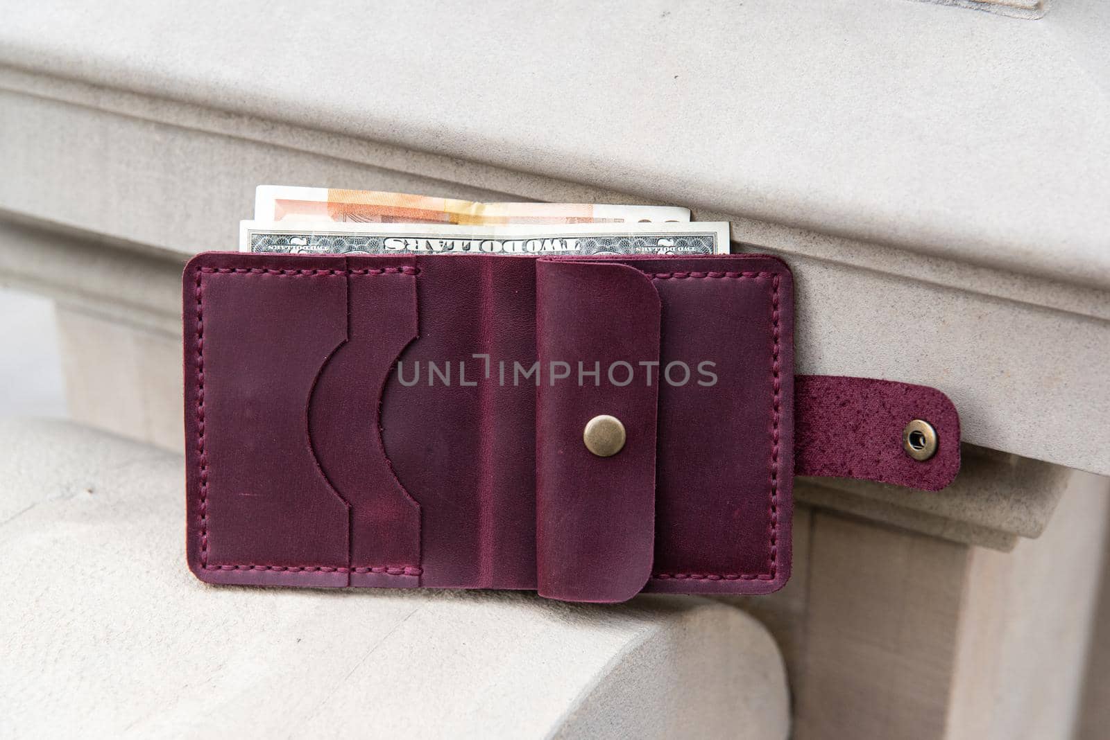 hand made leather wallet . Leather craft. Selective focus by Ashtray25