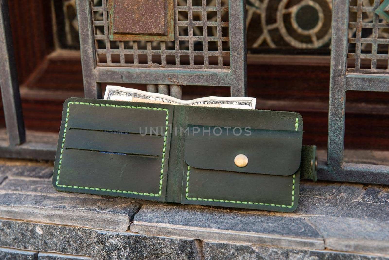 hand made leather wallet . Leather craft. Selective focus by Ashtray25