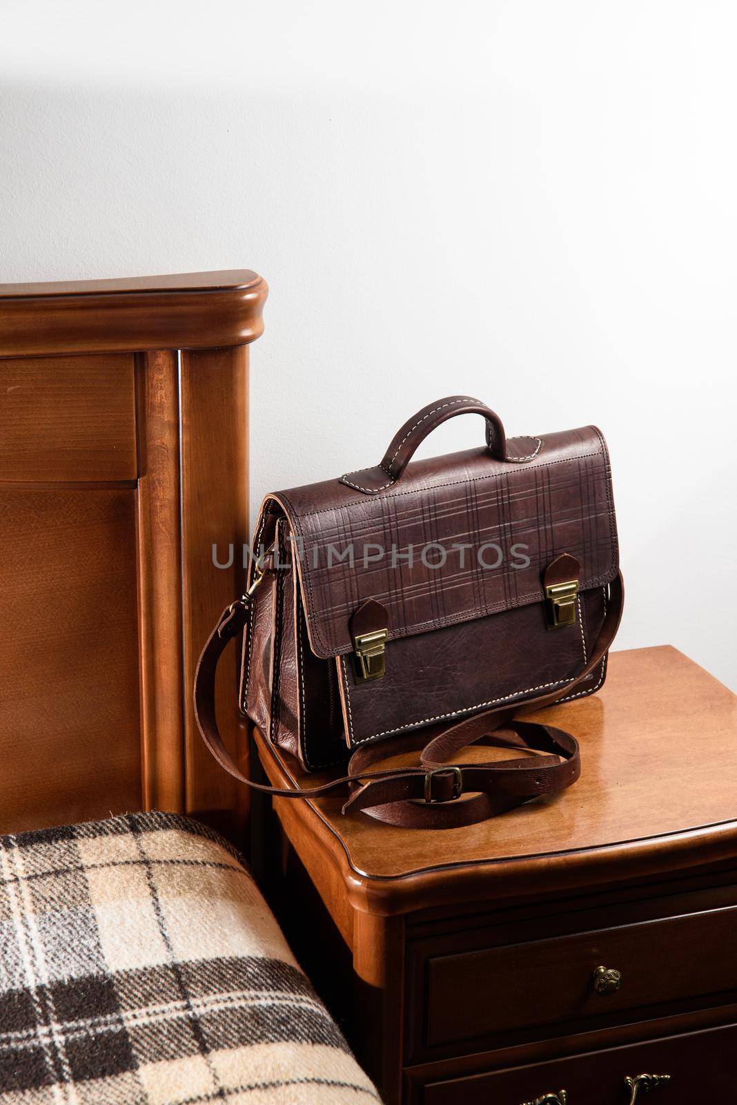 Brown leather briefcase with two locks. hotel room photo by Ashtray25