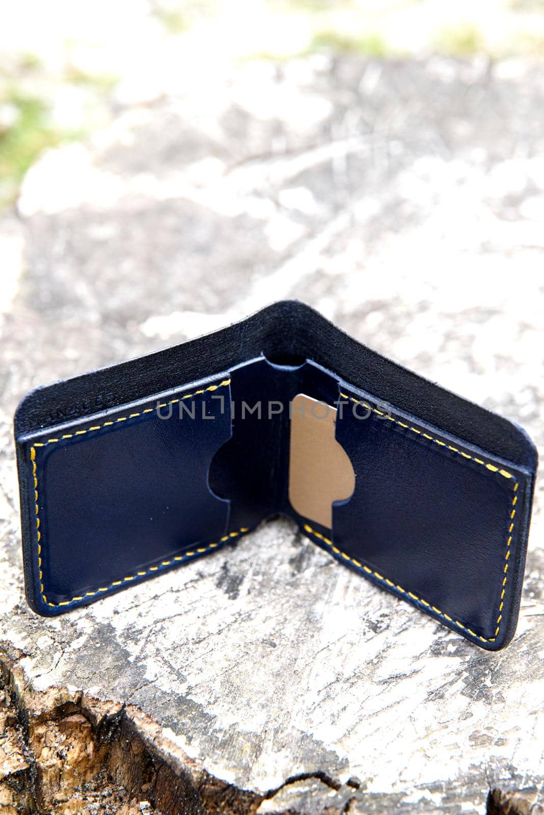 hand made blue leather wallet . Leather craft. Selective focus by Ashtray25