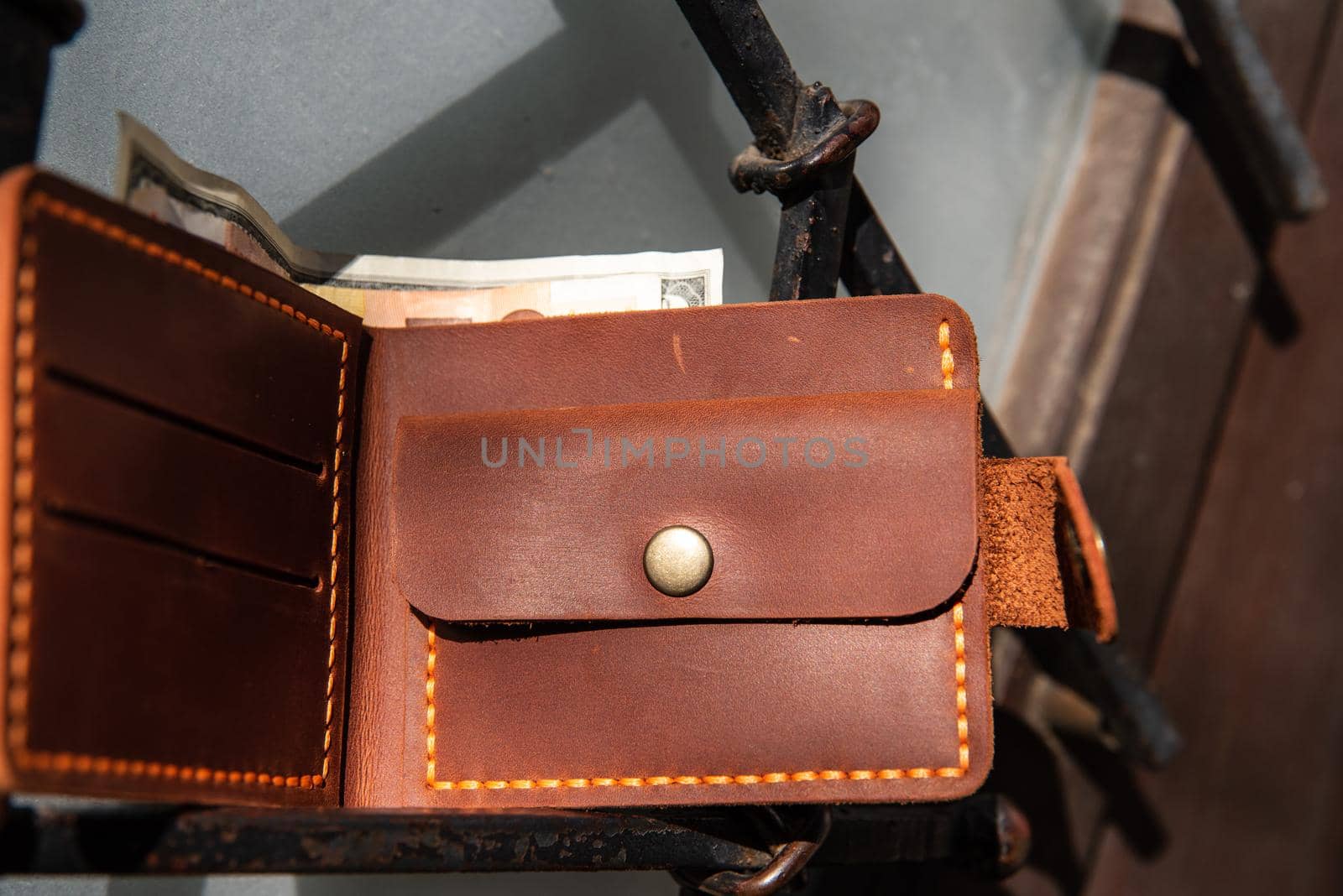 hand made leather wallet . Leather craft. Selective focus by Ashtray25