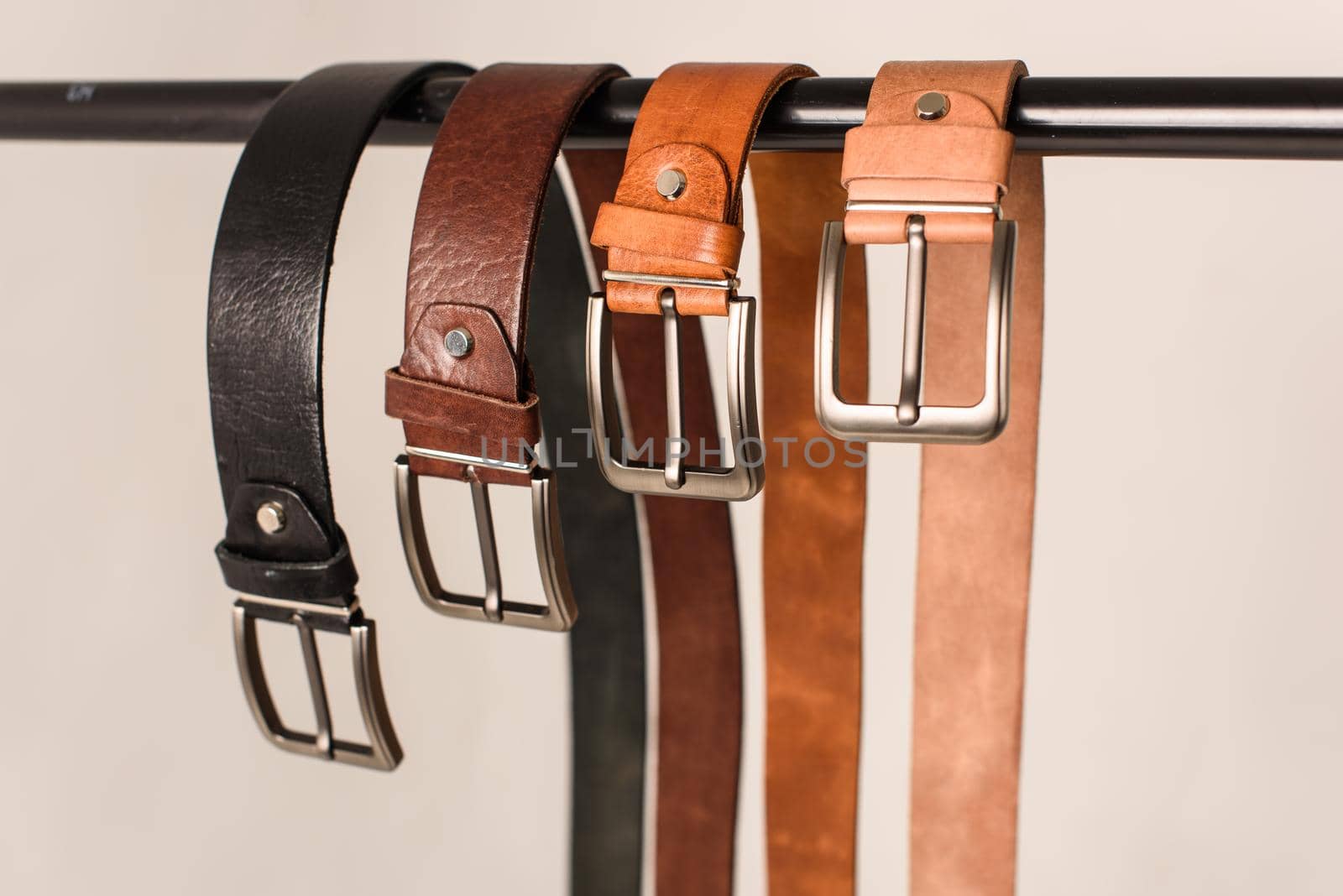 A set of colorful mens genuine sueded leather belts. fashion accessories.