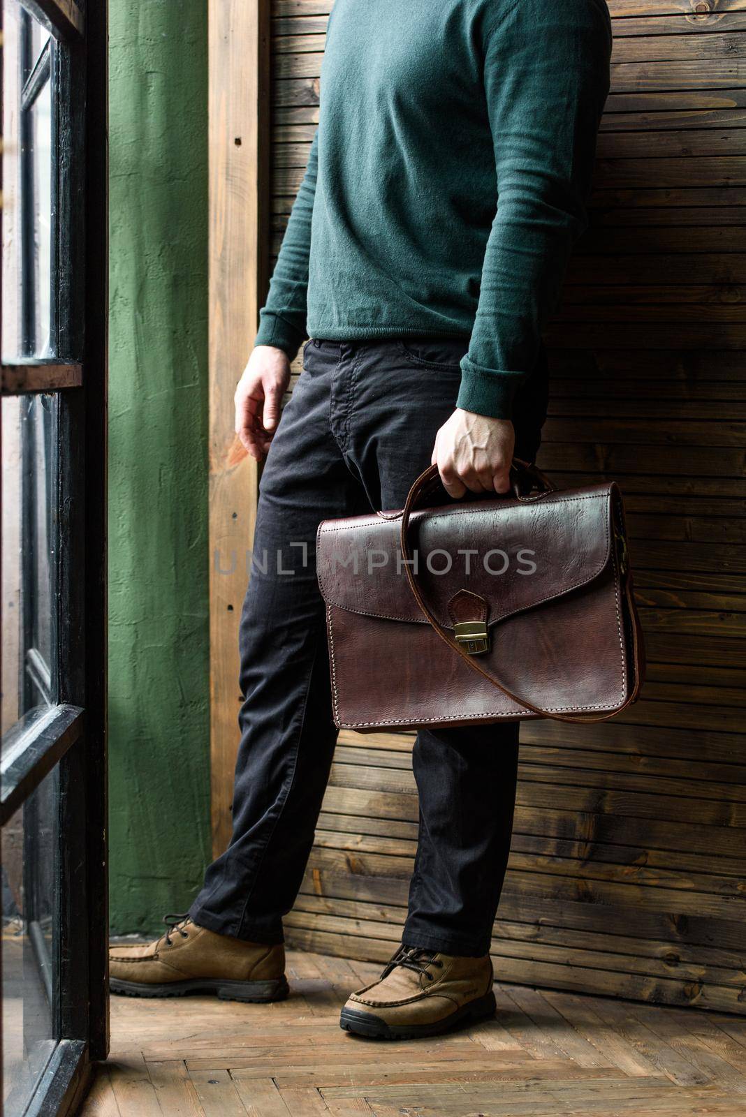 close-up photo of brown leather bag corporate. indoor photo