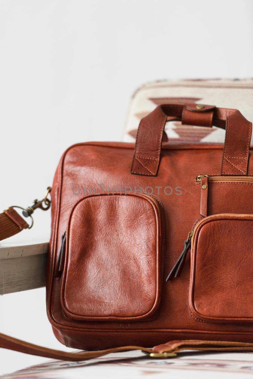 close-up photo of red leather bag corporate. Indoor photo