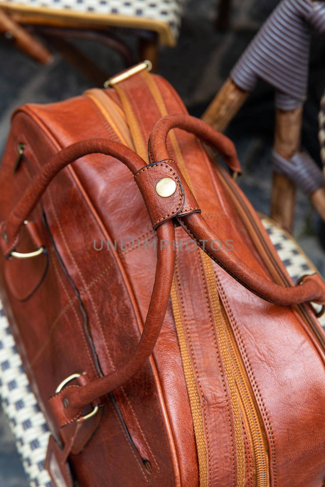 close-up photo of brown leather bag corporate. street photo