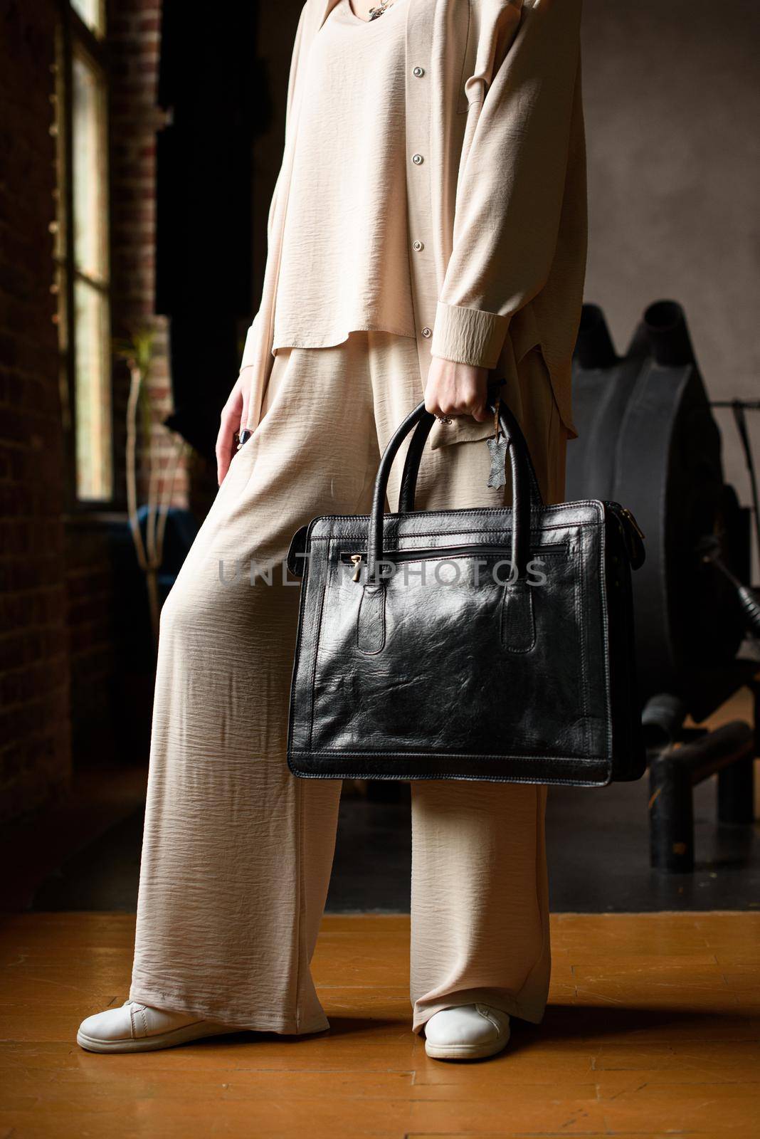 close-up photo of black leather bag corporate. indoor photo