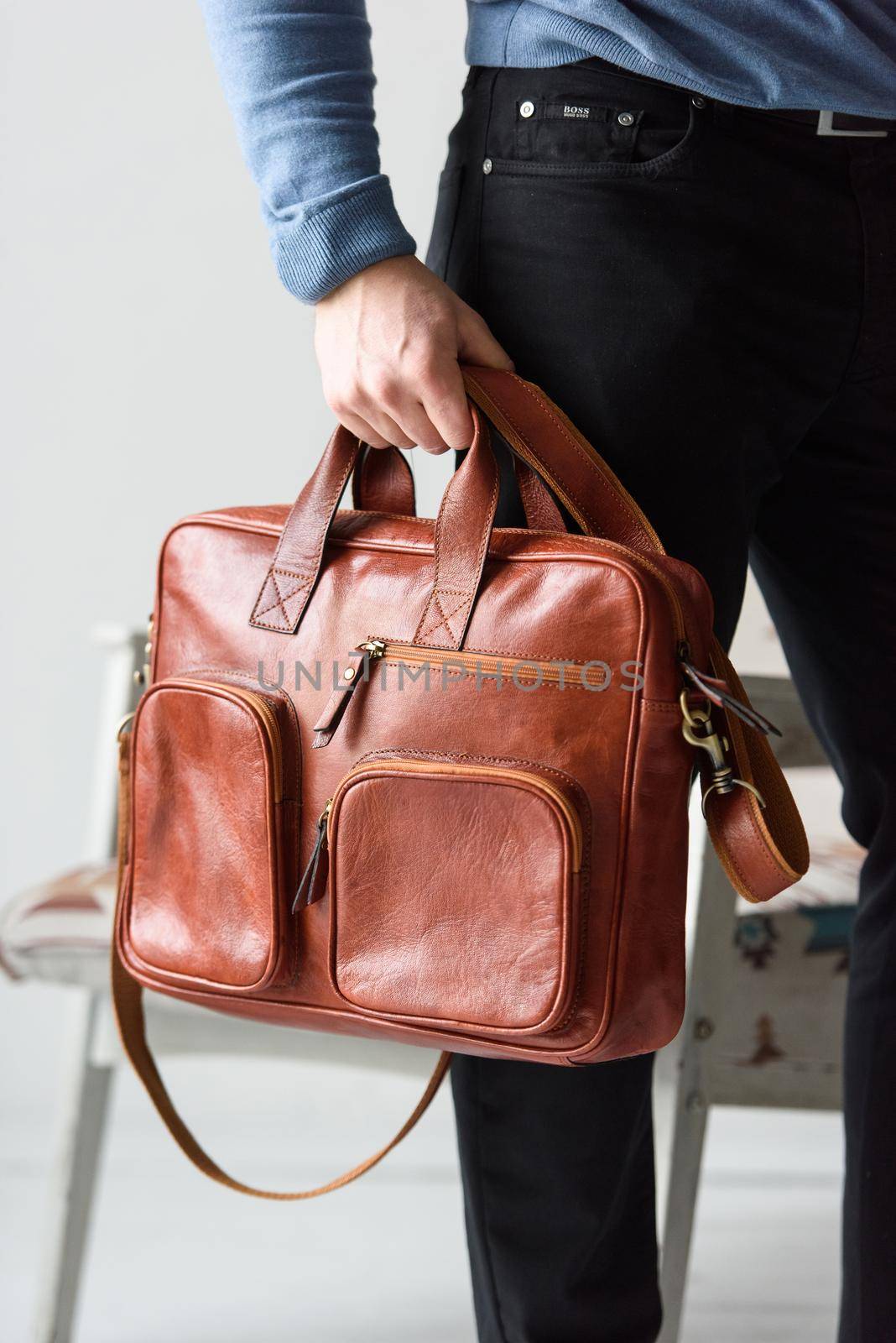 Side view of man in a blue sweater with red leather briefcase. Retro style. Unisex bag for sale. by Ashtray25