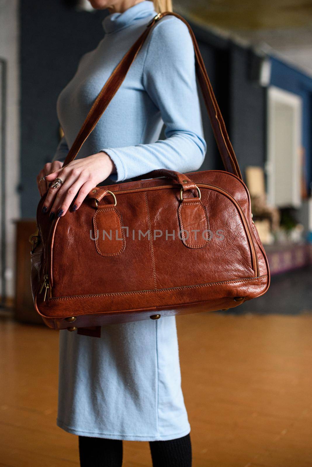 close-up photo of orange leather bag corporate. indoor photo