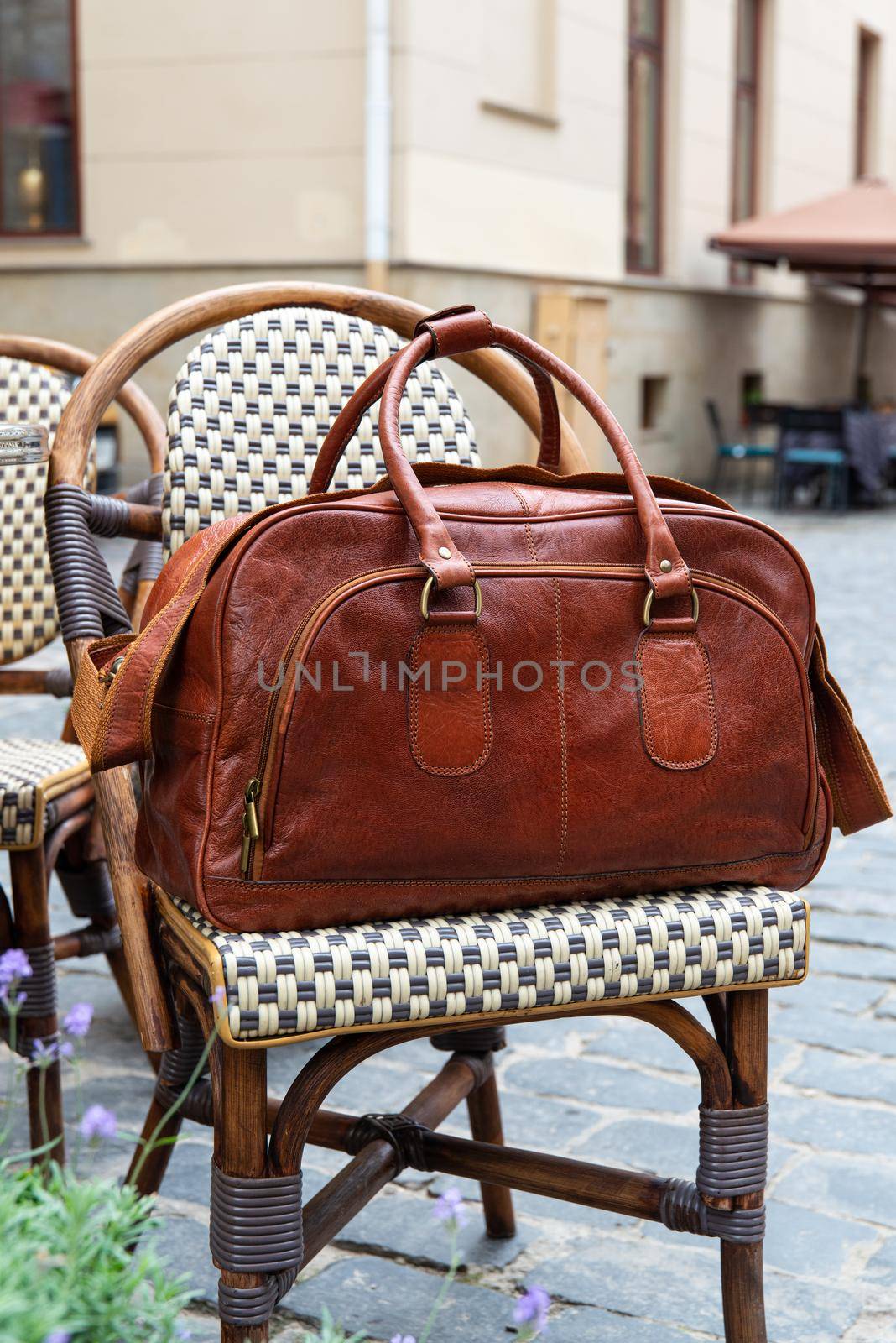 close-up photo of brown leather bag corporate. street photo