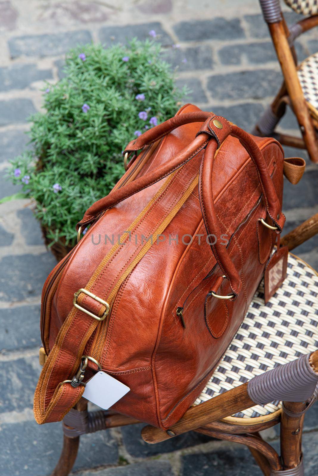 close-up photo of brown leather bag corporate. street photo