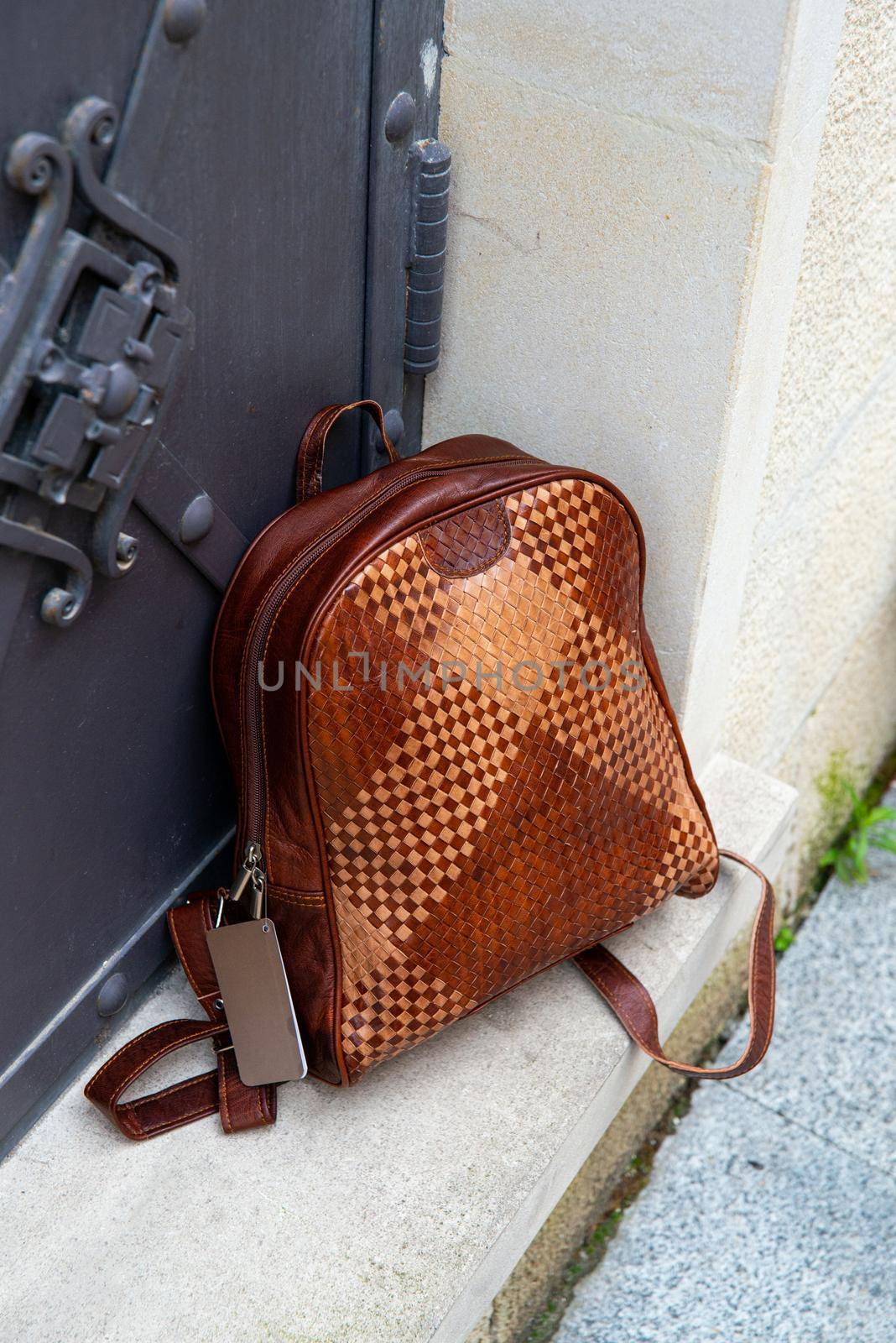 Brown leather backpack with a pattern. outdoors photo by Ashtray25