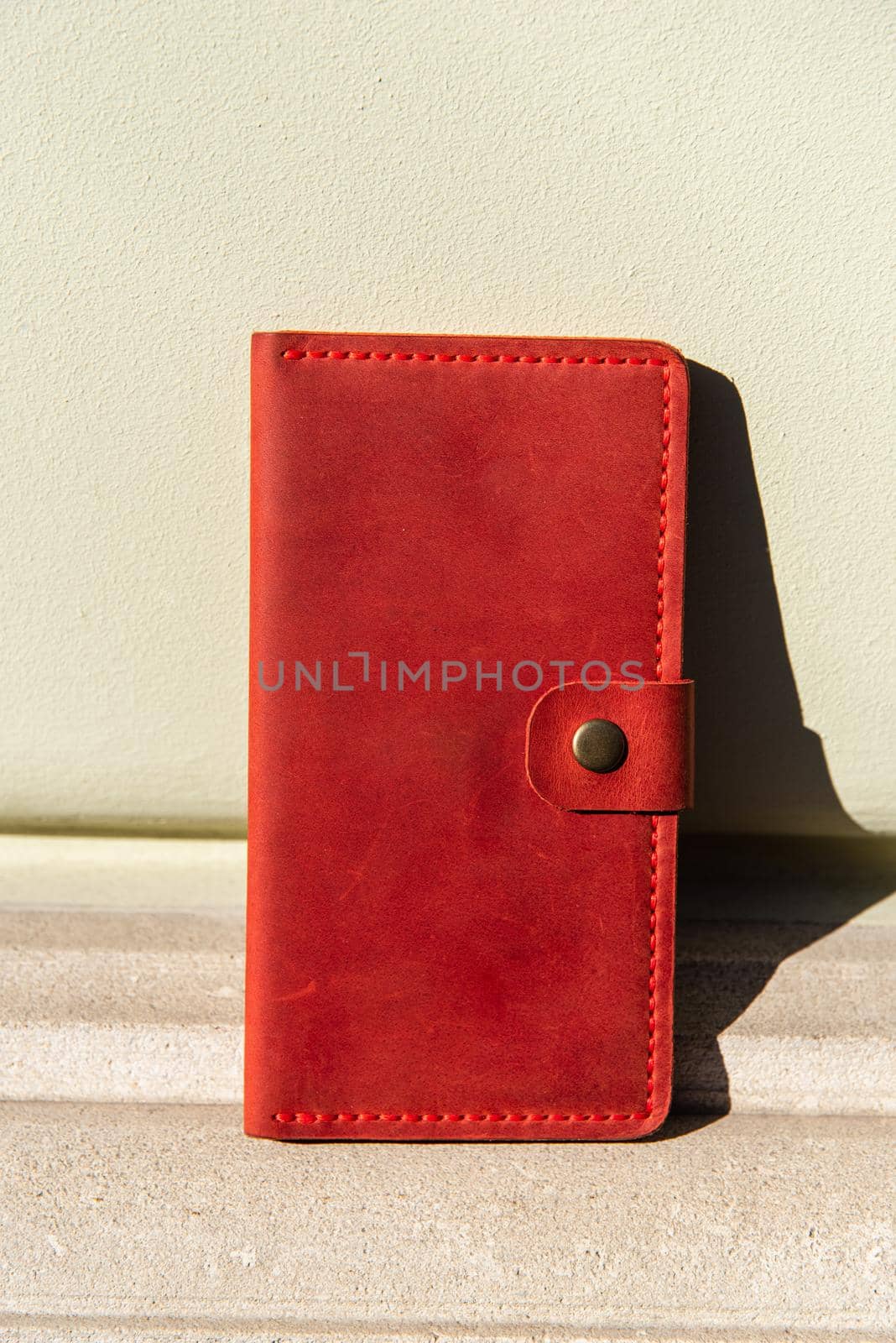 hand made leather wallet . Leather craft. Selective focus by Ashtray25