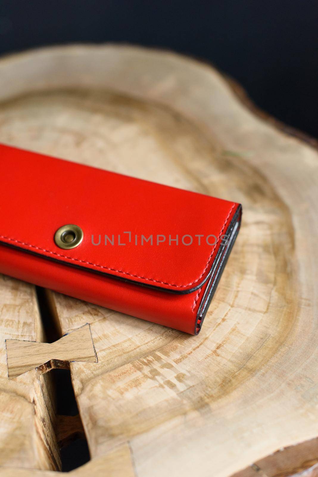 hand made red leather wallet . Leather craft. Selective focus by Ashtray25