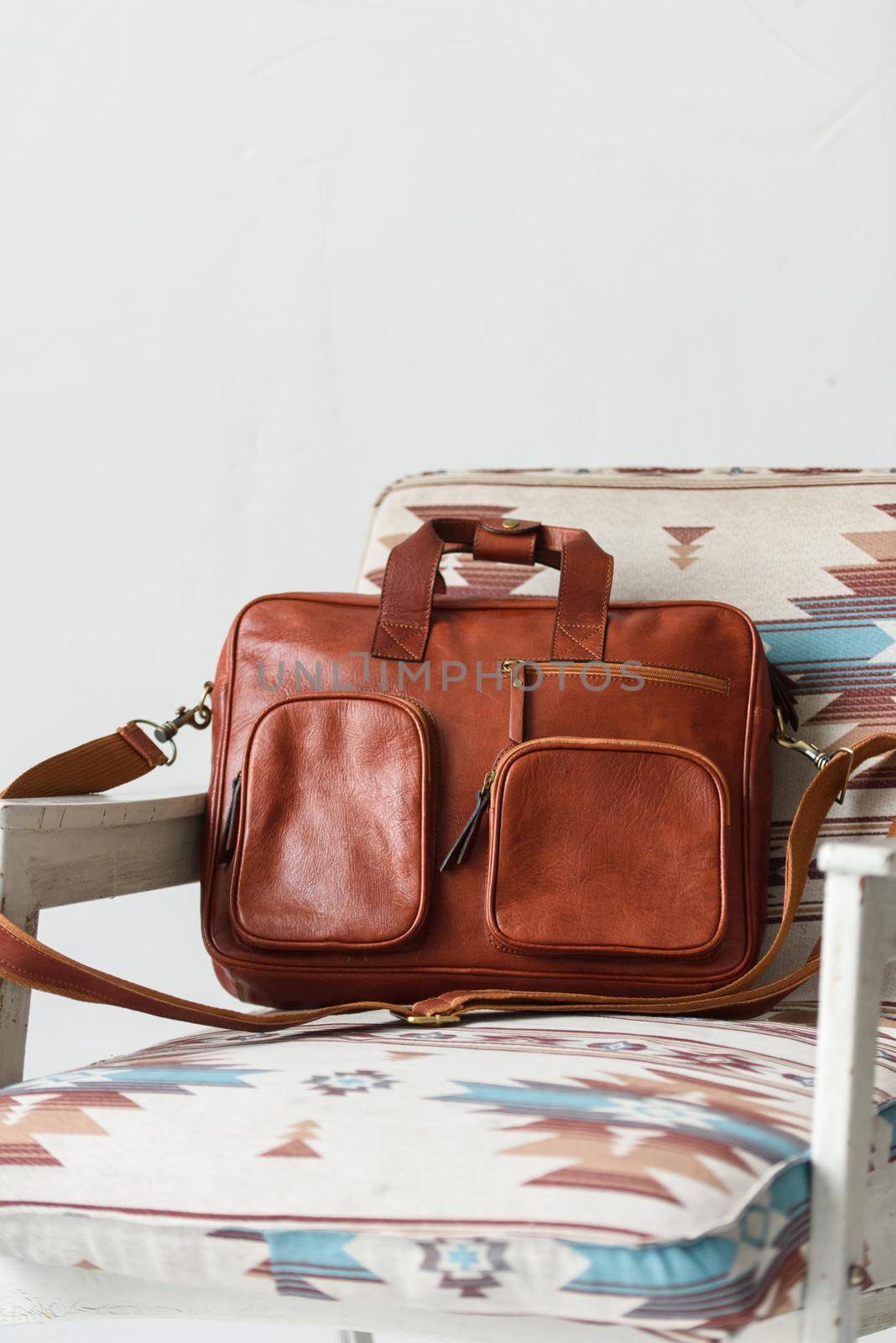 close-up photo of red leather bag corporate. Indoor photo