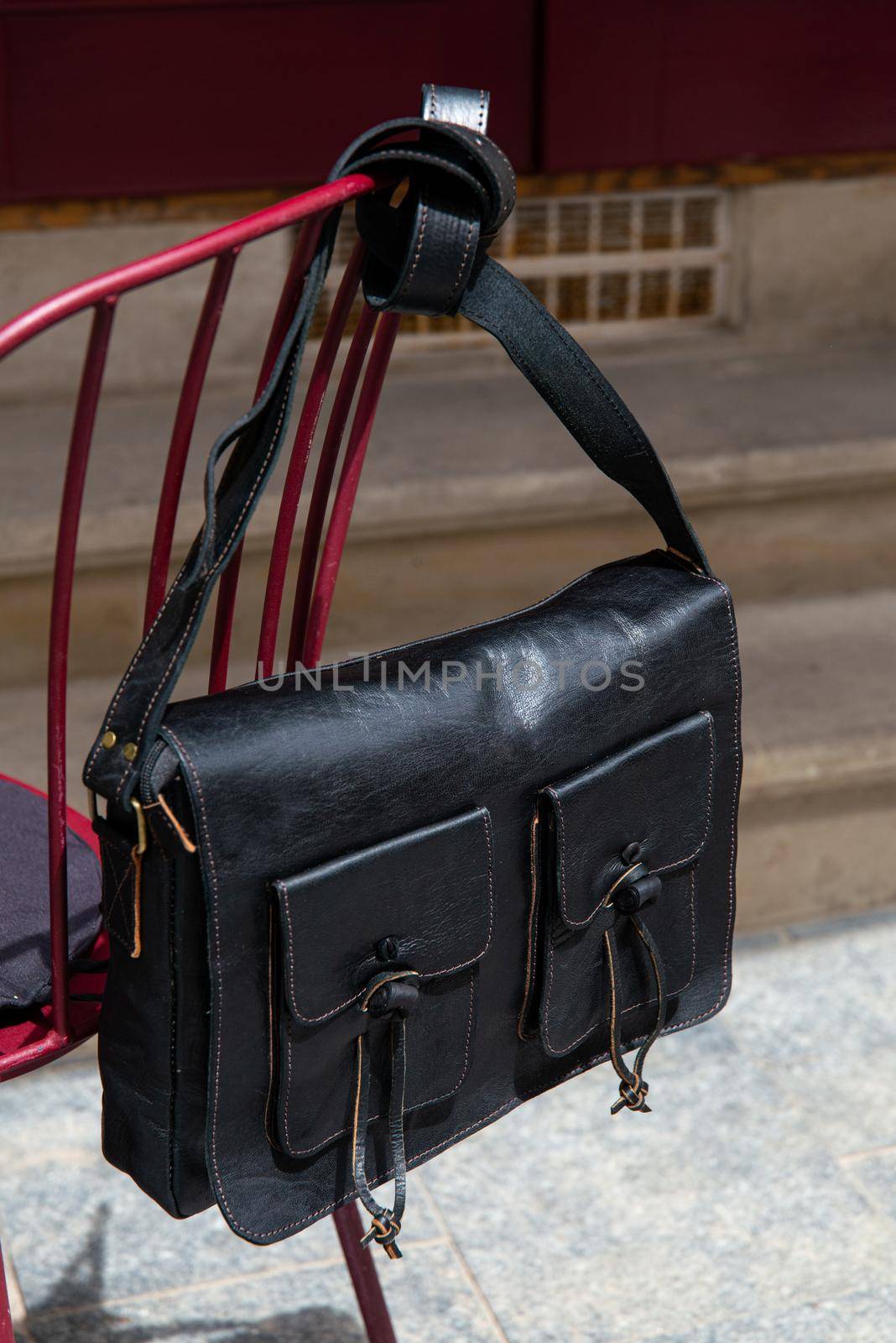 close-up photo of black leather bag corporate. street photo