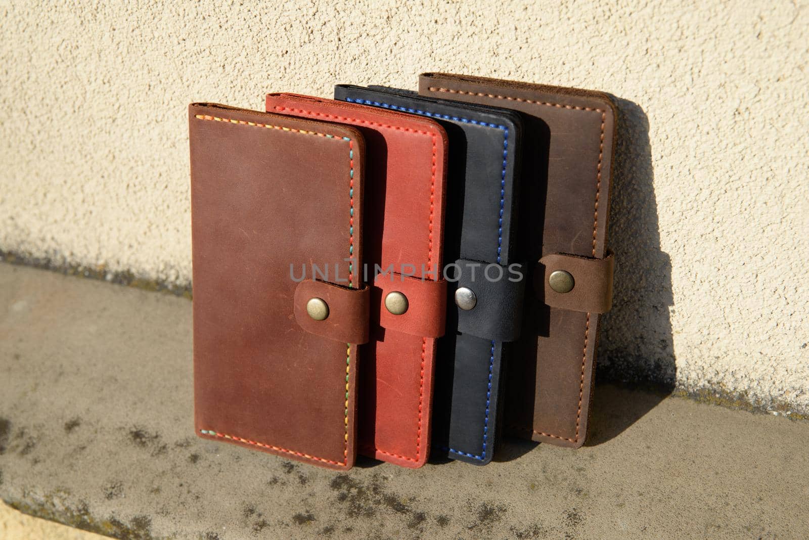 Set of hand made leather man wallet . Multi colored. Leather craft. Selective focus.