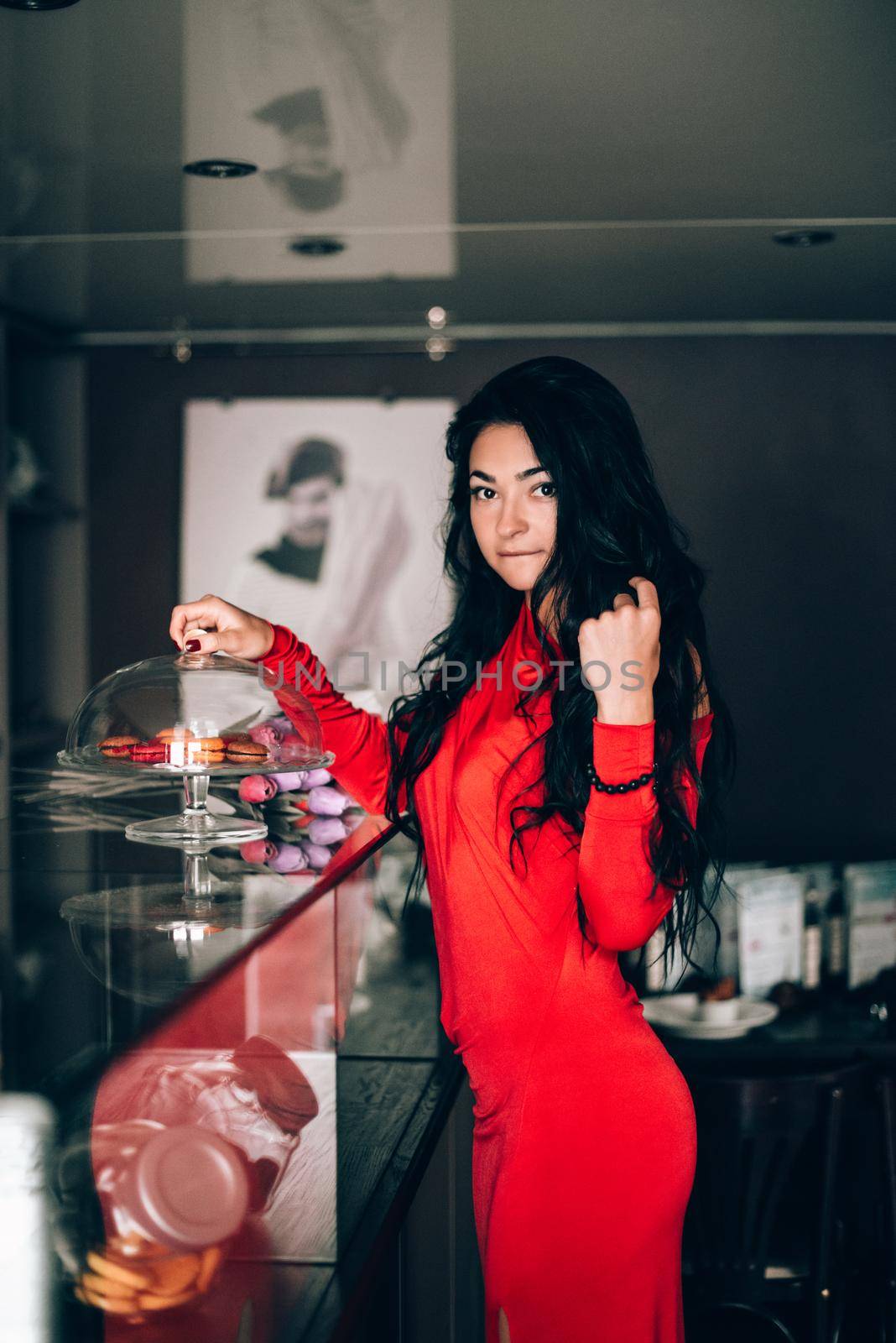 Portrait of a sexy woman in a red dress with black hair in a confectionery. Long black hair. obsession with red. Selective focus, film grain by Ashtray25