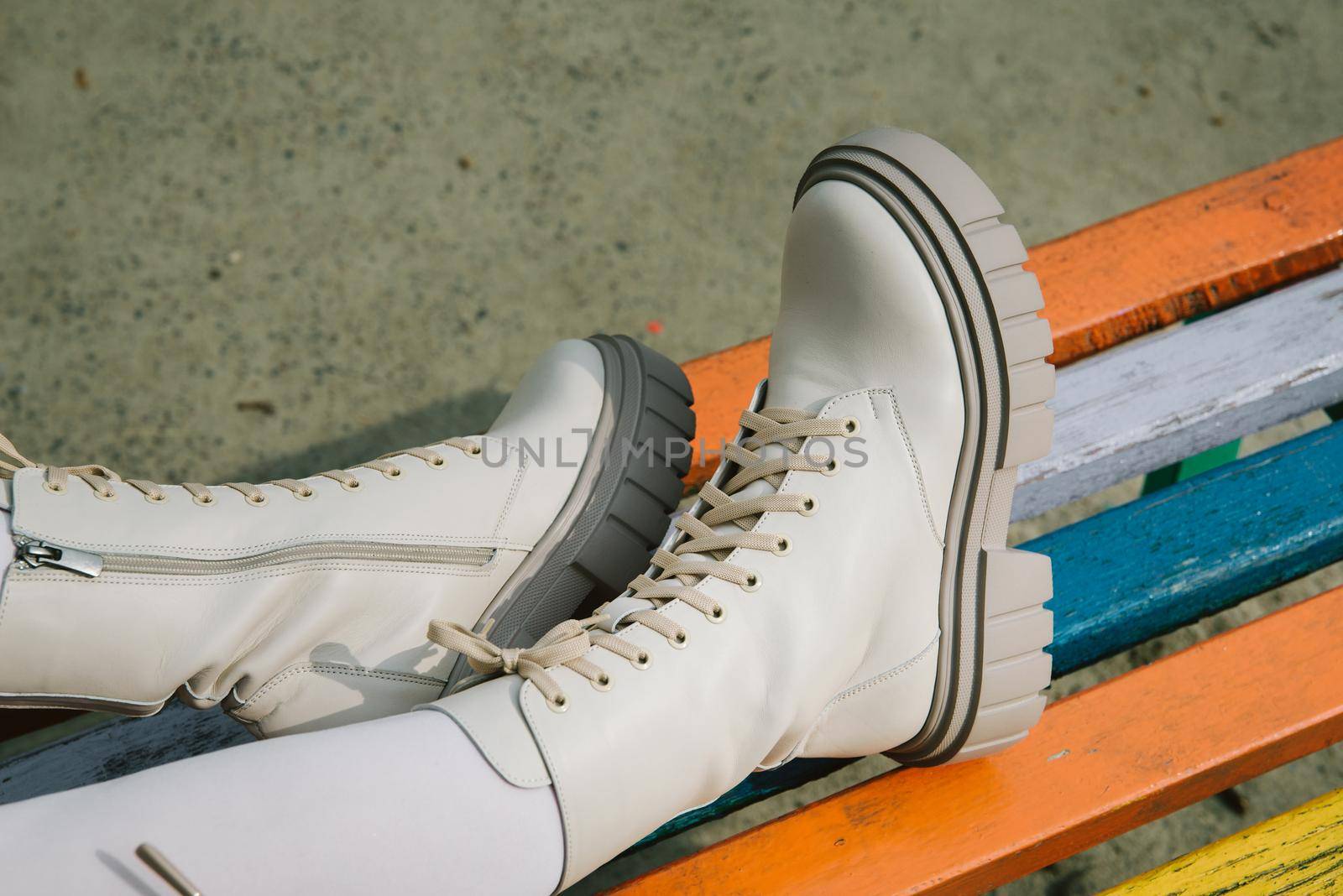 Female legs wearing white fashion boots with laces by Ashtray25