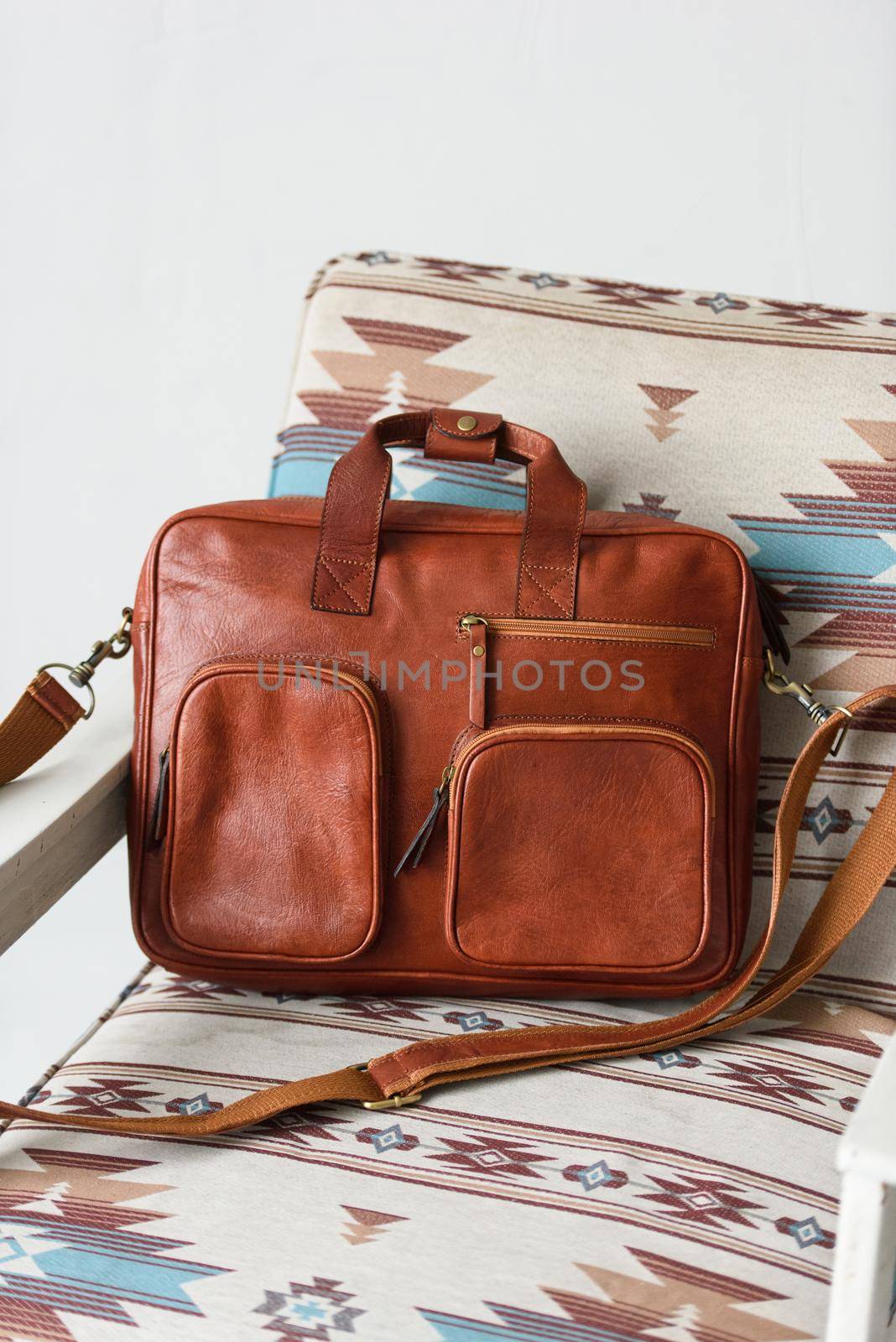 close-up photo of red leather bag corporate. Indoor photo