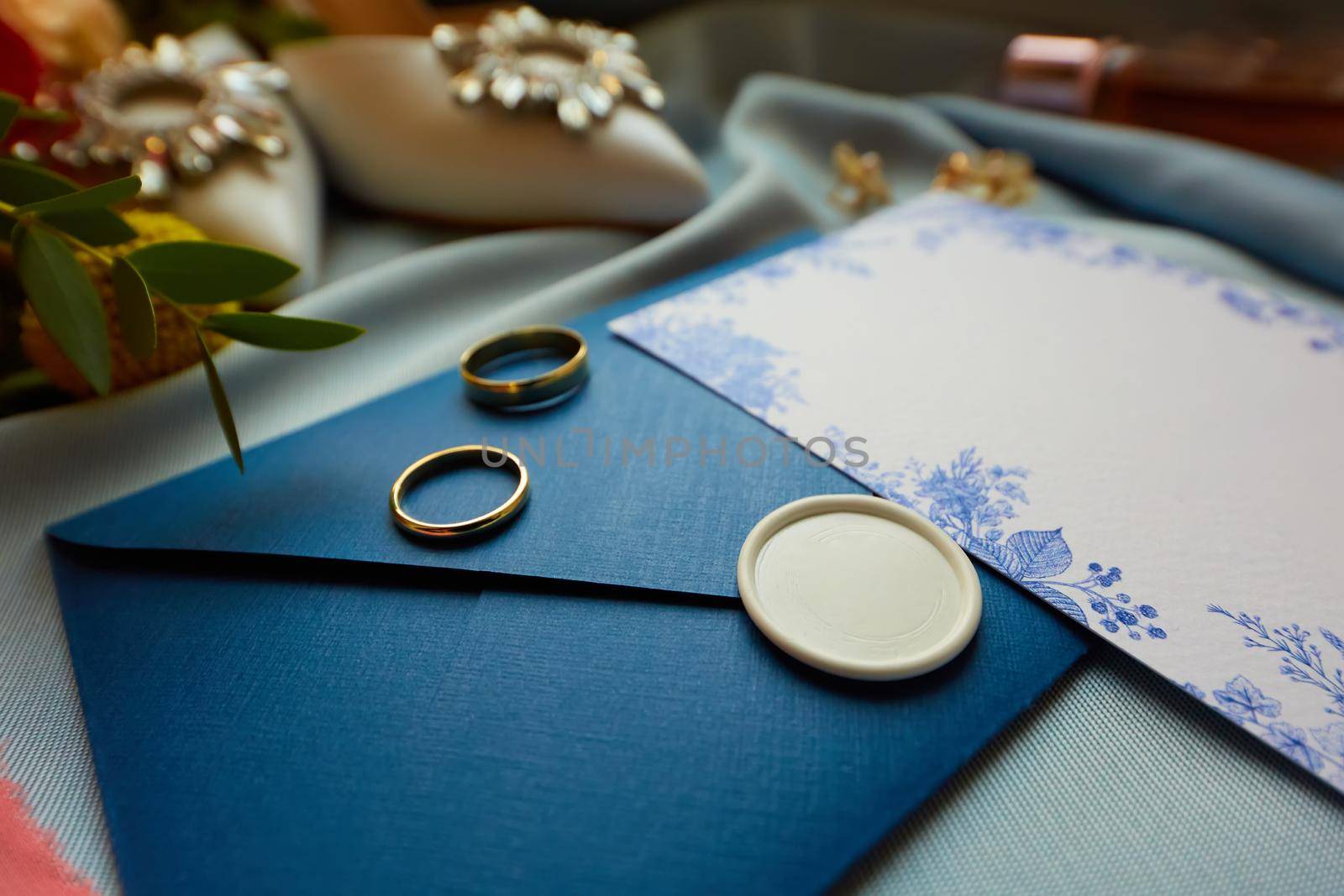 Wedding rings and wedding invitation. Shallow dof by sarymsakov