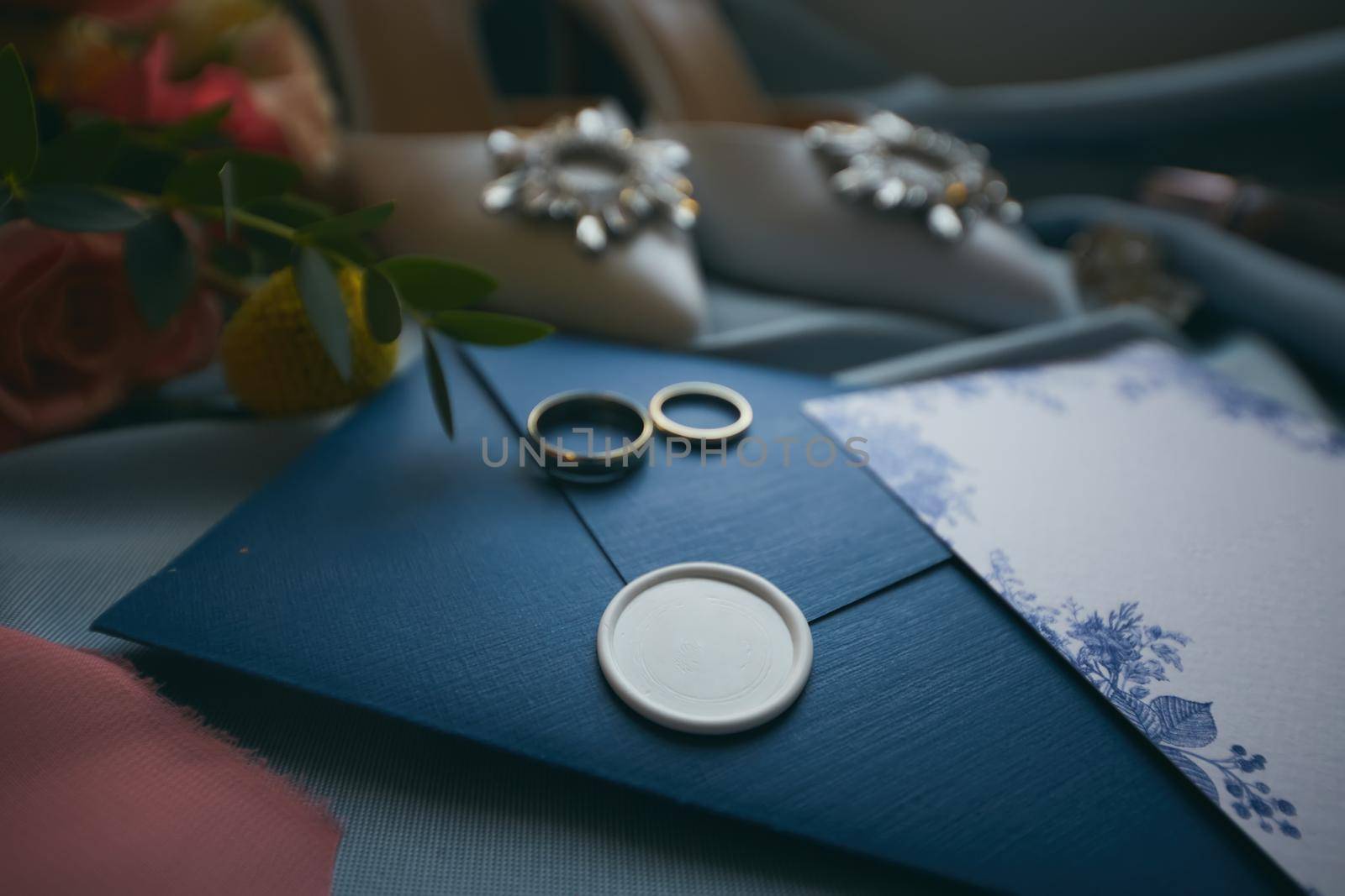 Wedding rings and wedding invitation. Shallow dof by sarymsakov