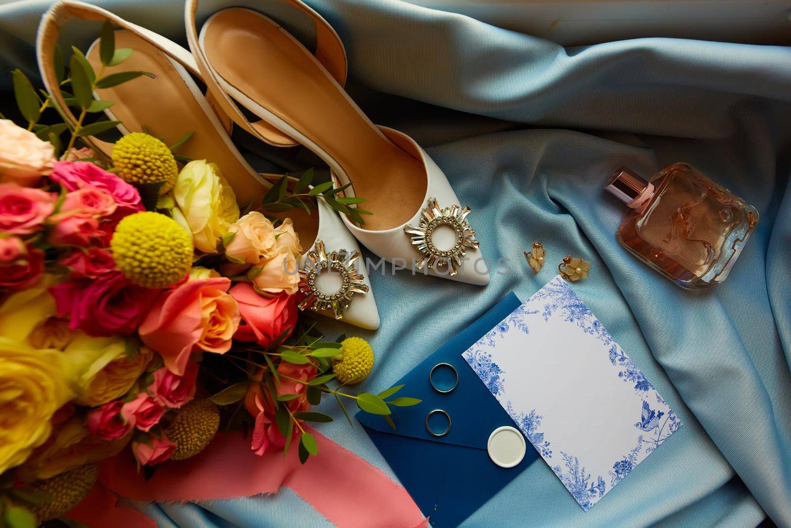 Wedding rings and wedding invitation. Shallow dof.