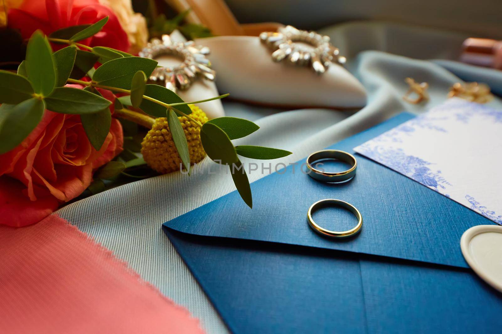 Wedding rings and wedding invitation. Shallow dof.