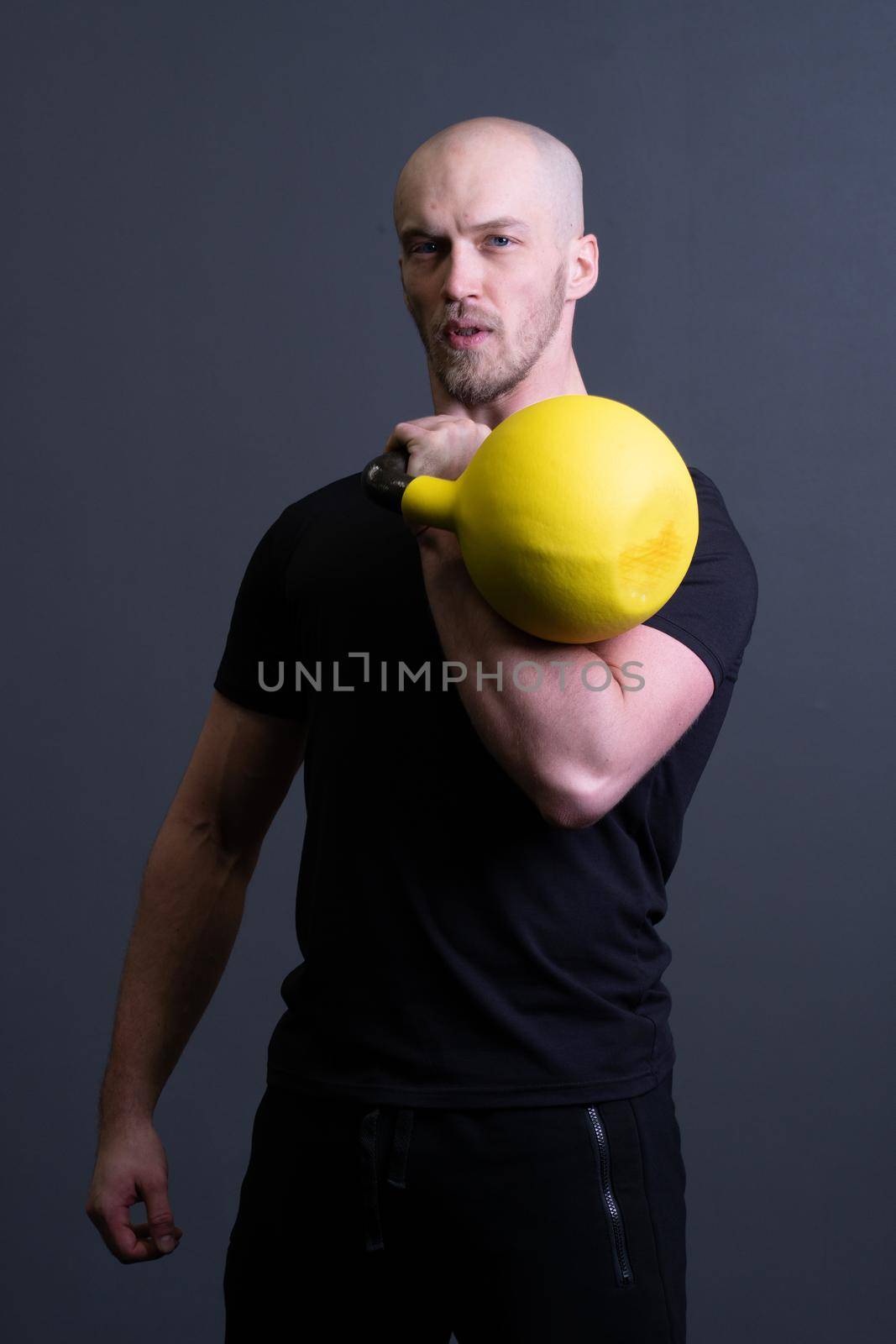 Guy with a yellow kettlebell gym anonymous young male, from motivation effort from men for resitance sportswear, malaysian fitness. Living bent health, club hiit