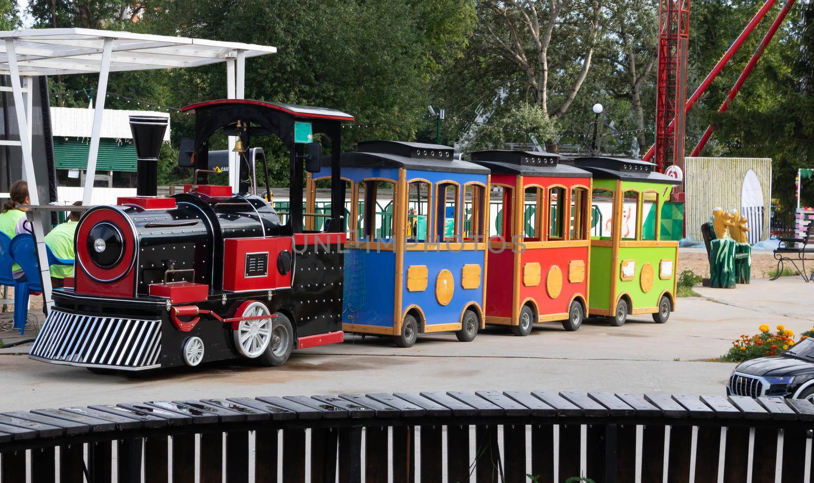 A train with trailers for children, on the playground.