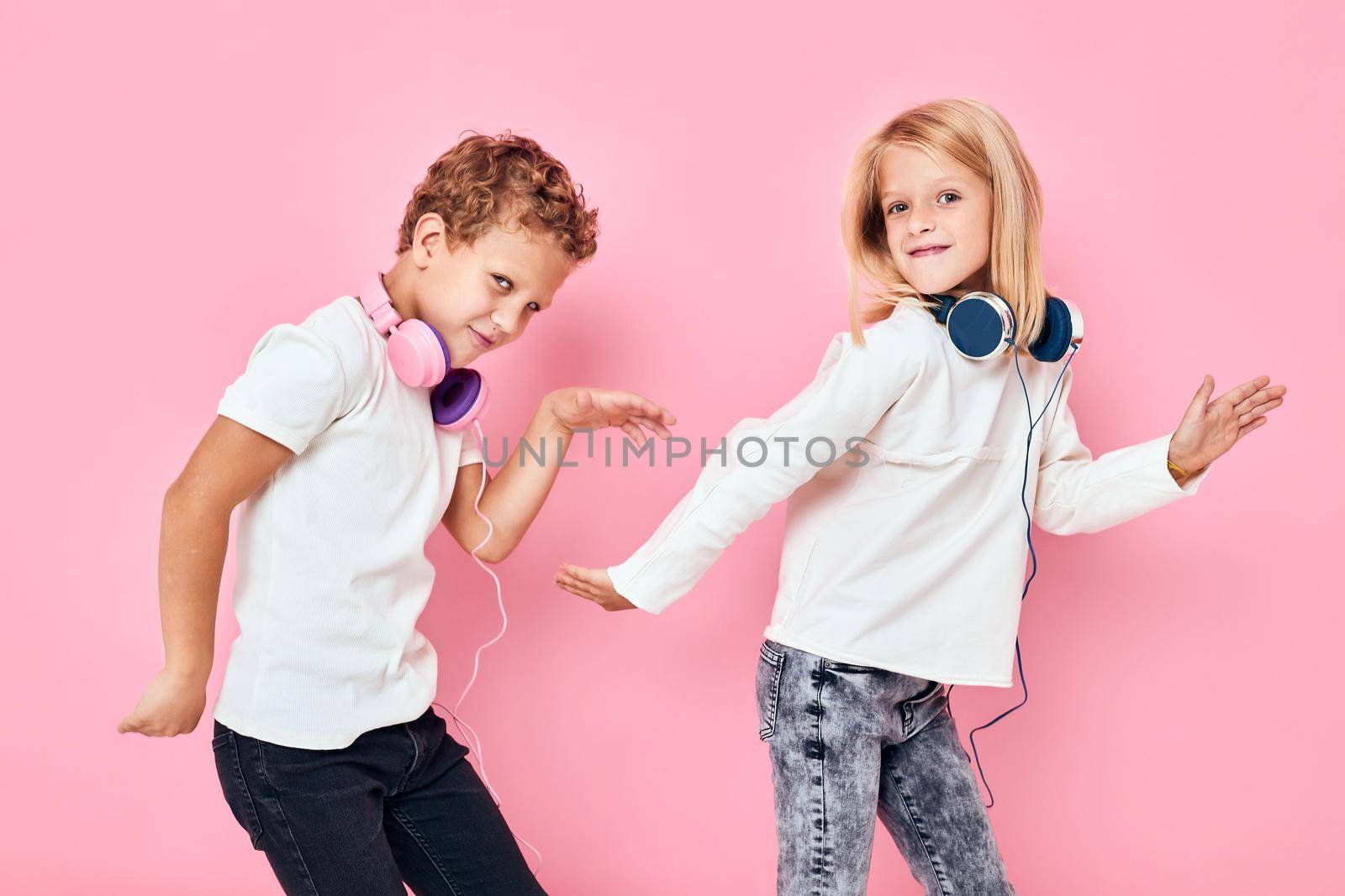 Active young people dancing with headphones entertainment isolated background by SHOTPRIME