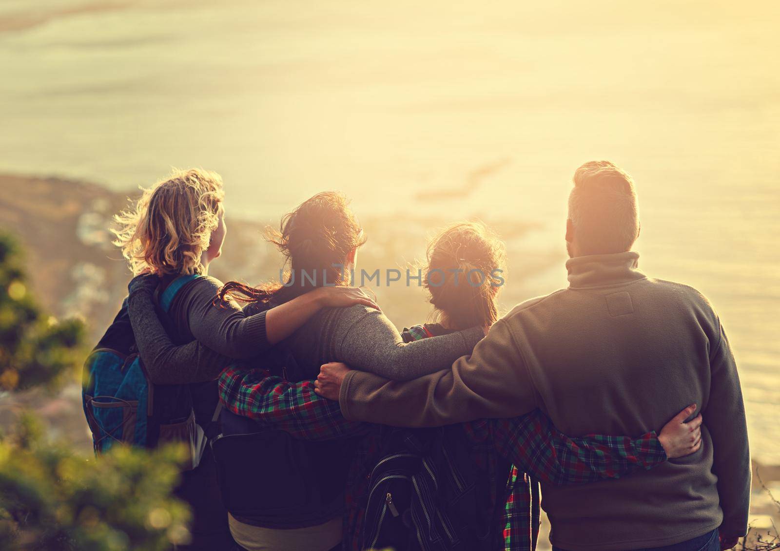 Shot of a group of friends on a mountain top.