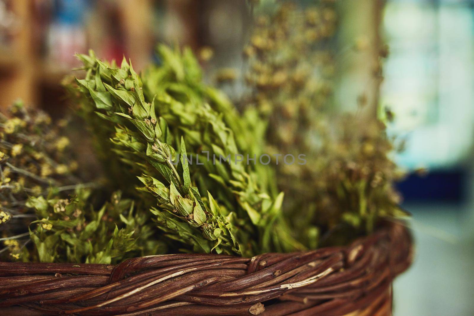 Let food be thy medicine. Shot of herbs in a store. by YuriArcurs
