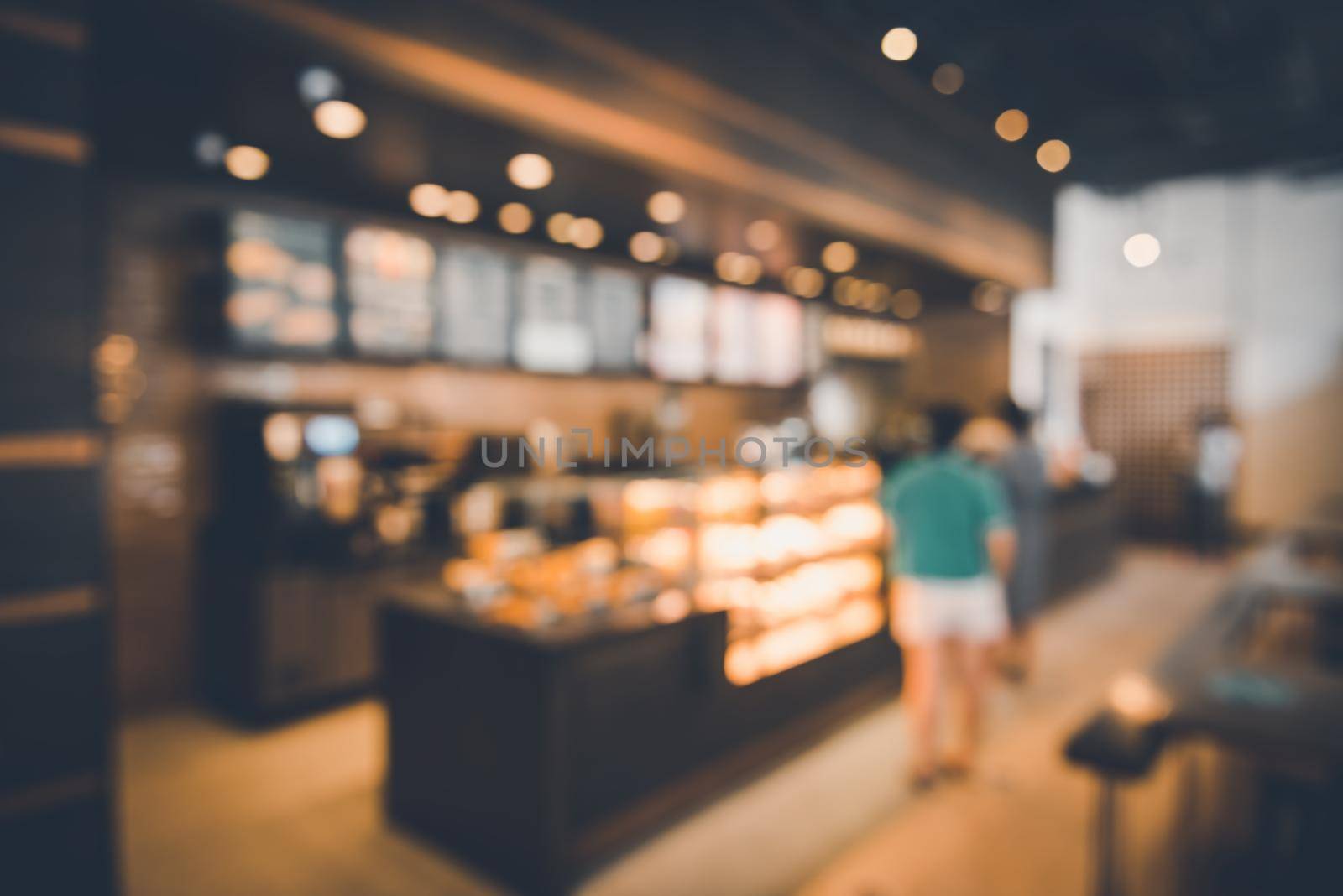 Blur Coffee Cafe Shop and Bokeh Light Bulb Background. Defocused Image and Blur Customer People in Coffee Counter Shop. Blur Cafe Store Shop Lifestyles and Client Service Food Event by MahaHeang245789