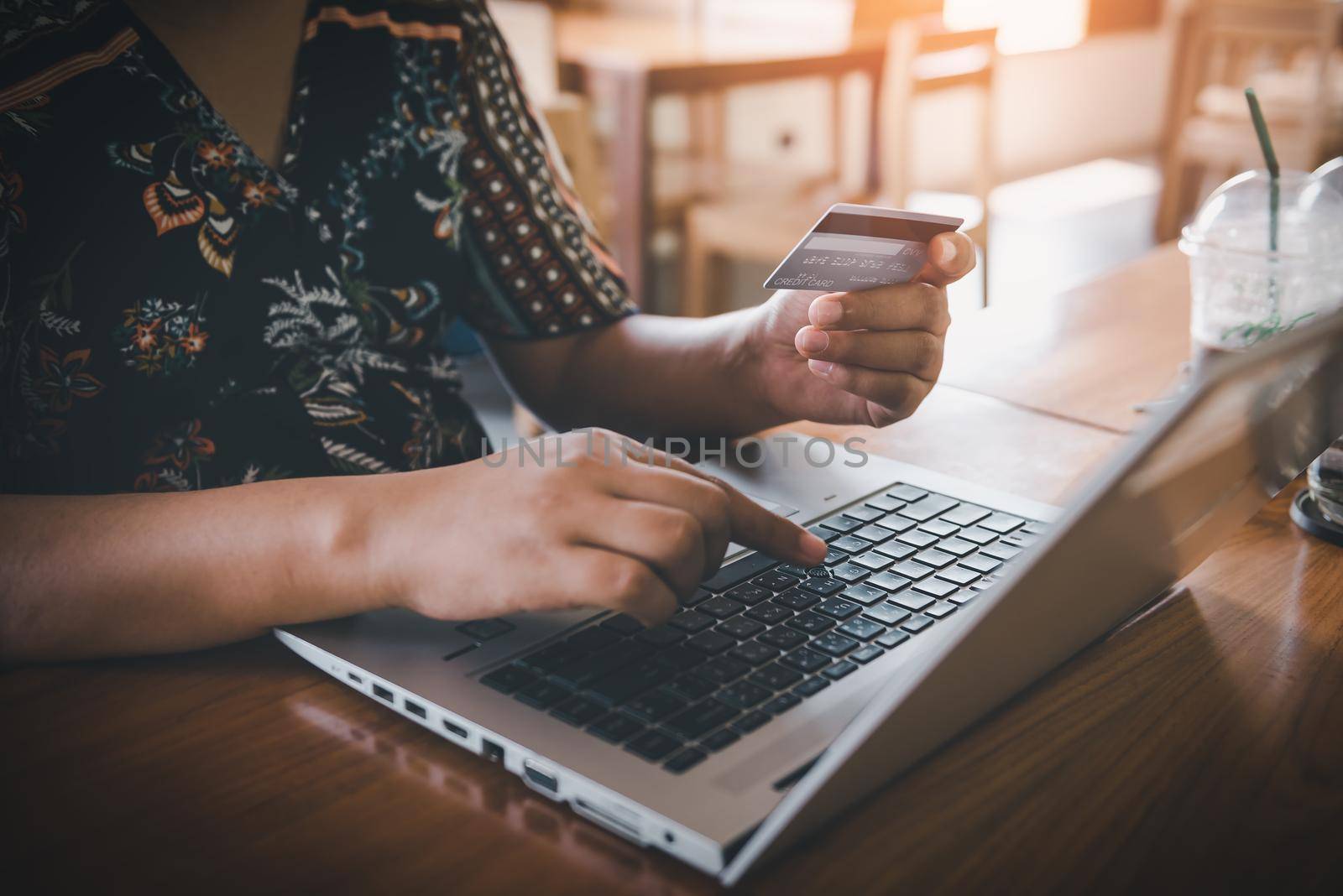 Business Credit Banking and Online Shopping Service, Close-Up of Business Woman Hands Using Credit Card for Paying Online Shopping on E-Commerce Web in Coffee Shop. Shopping Payment Via Credit Card