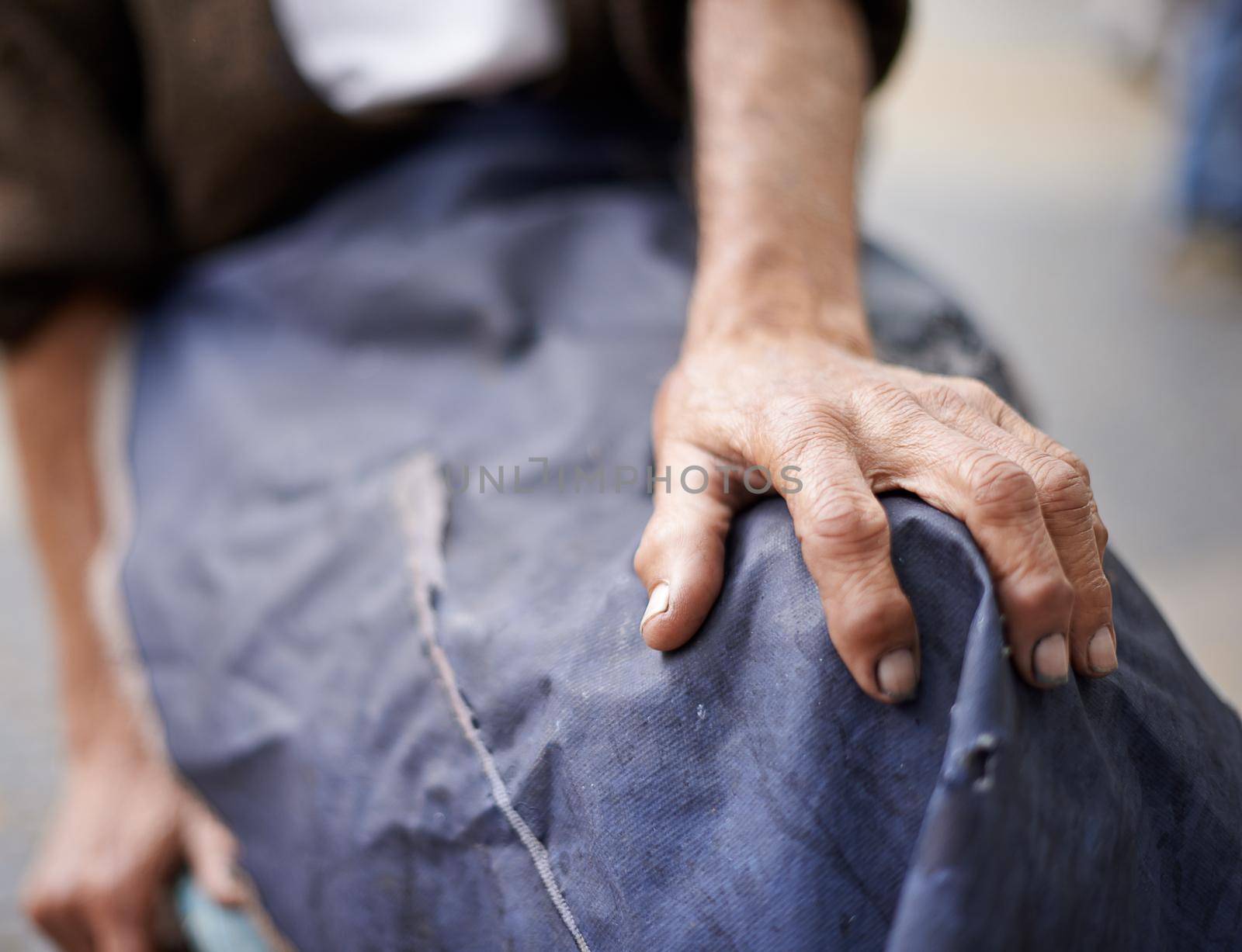 Cropped shot of an elderly man wearing an apron.