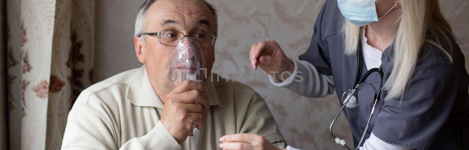 Elderly man on oxygen mask, nebulizer.