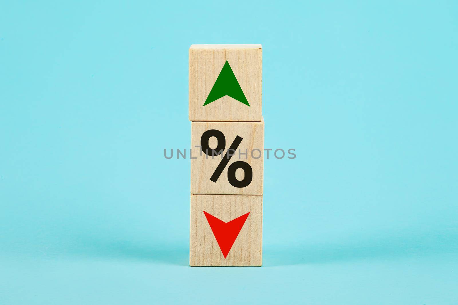 Cube block with percentage symbol icon. Interest rate financial and mortgage rates concept. Wood cube change arrow down to up. Interest rate, stocks, ranking. Business and finance concept