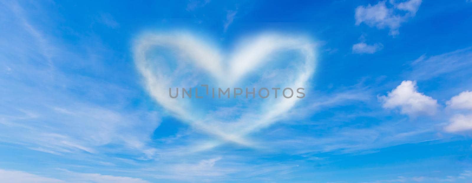 A cloud in the form of a heart. A figure from the clouds in the sky. Beautiful sky. Love. Imagination. Valentine's Day. Lovers. Fluffy cumulus cloud looks like a heart. Valentine's day symbol.
