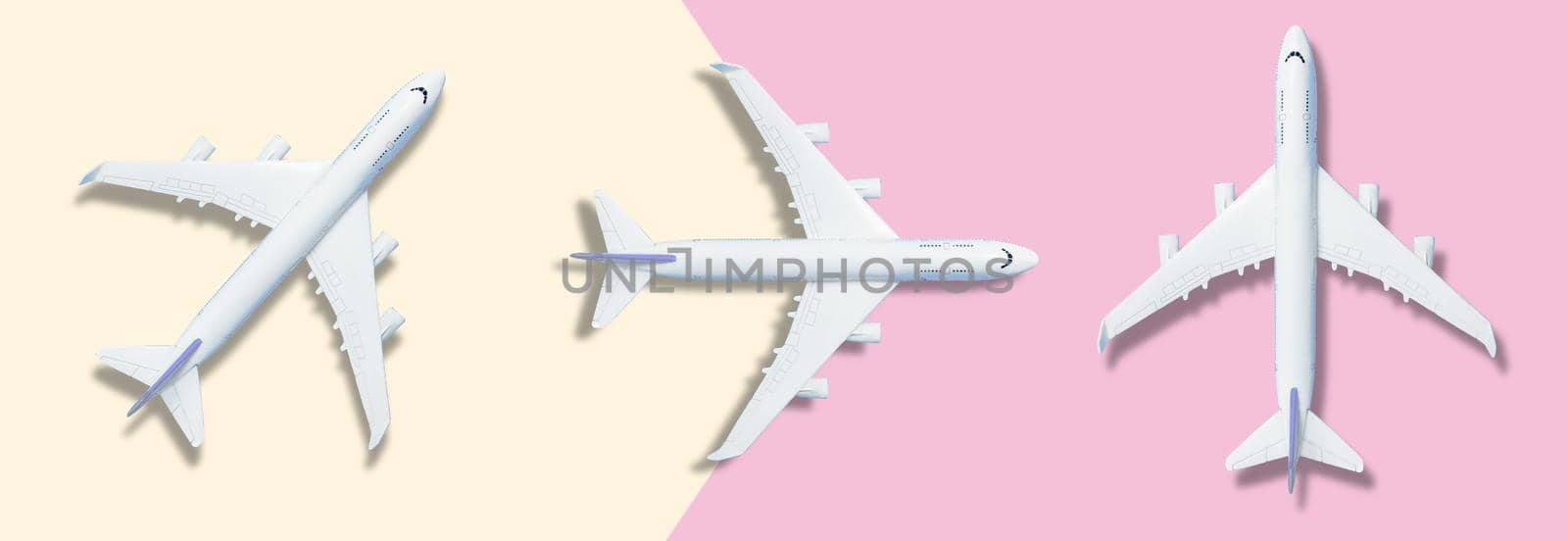 Flat lay design of travel concept with plane on blue background with copy space. High quality photo
