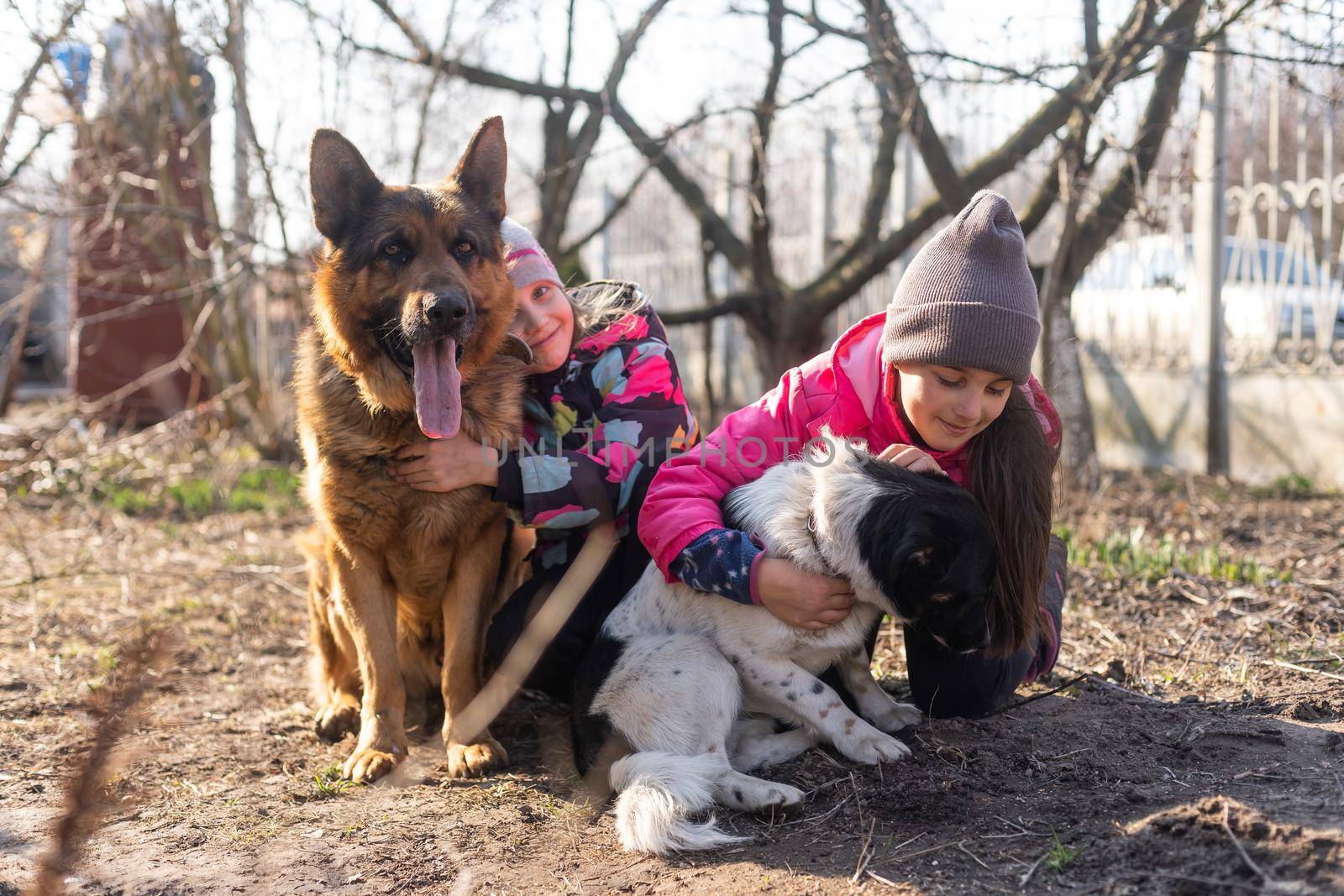 two little girls with two dogs by Andelov13