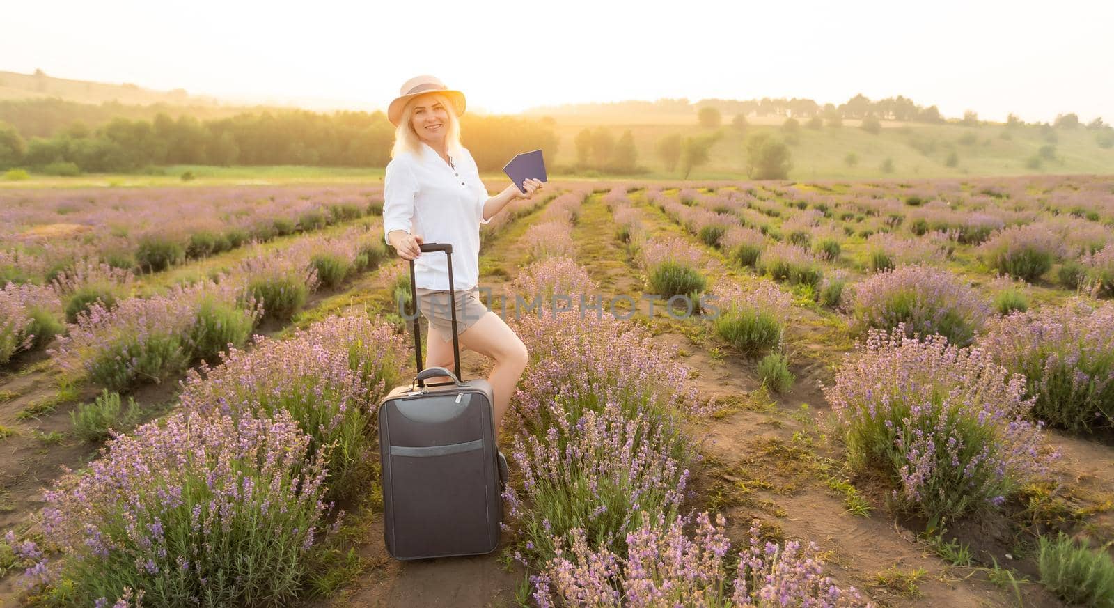 woman with bag in lavender field
