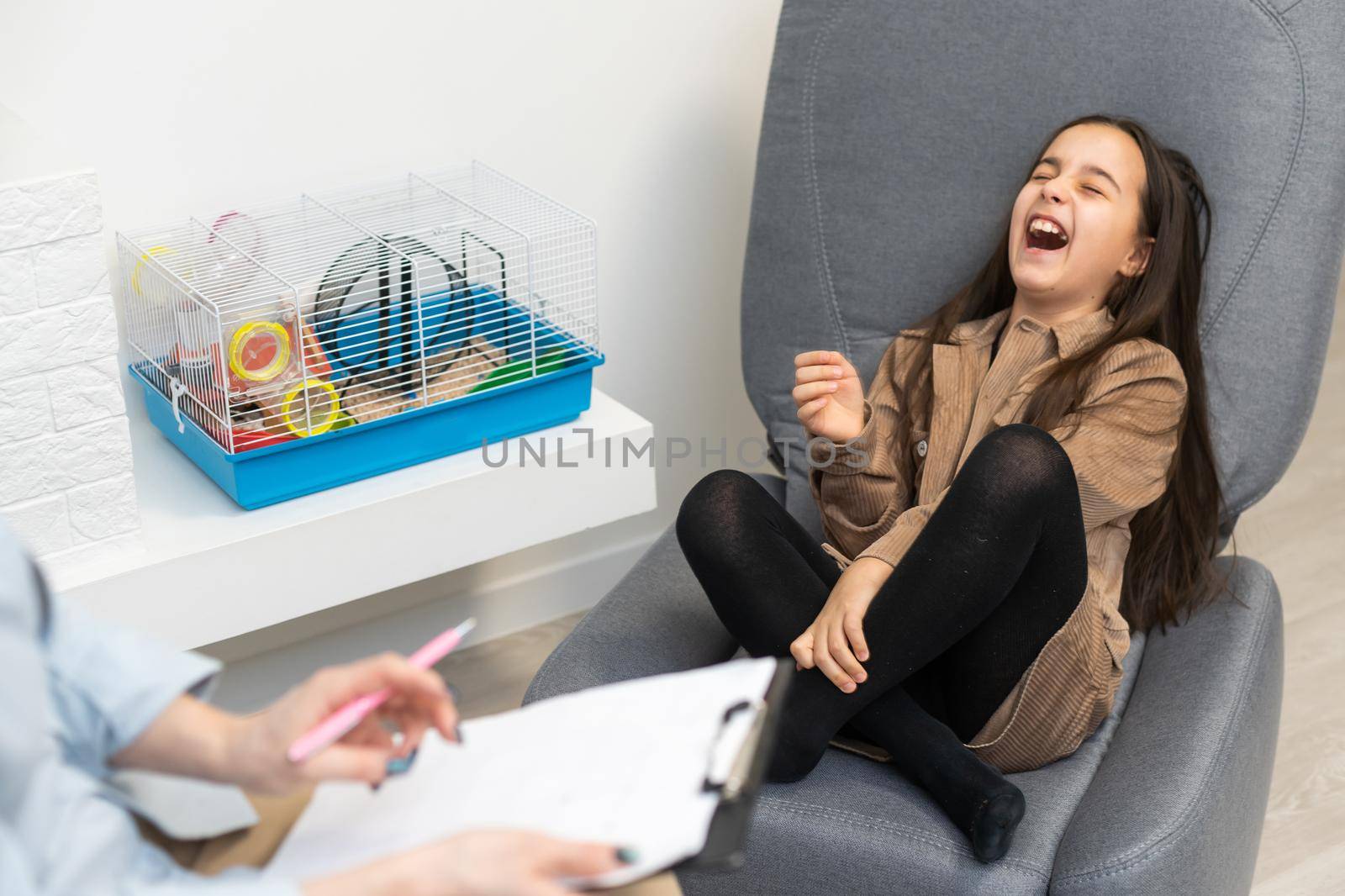 woman school psychologist communicates with a schoolgirl.