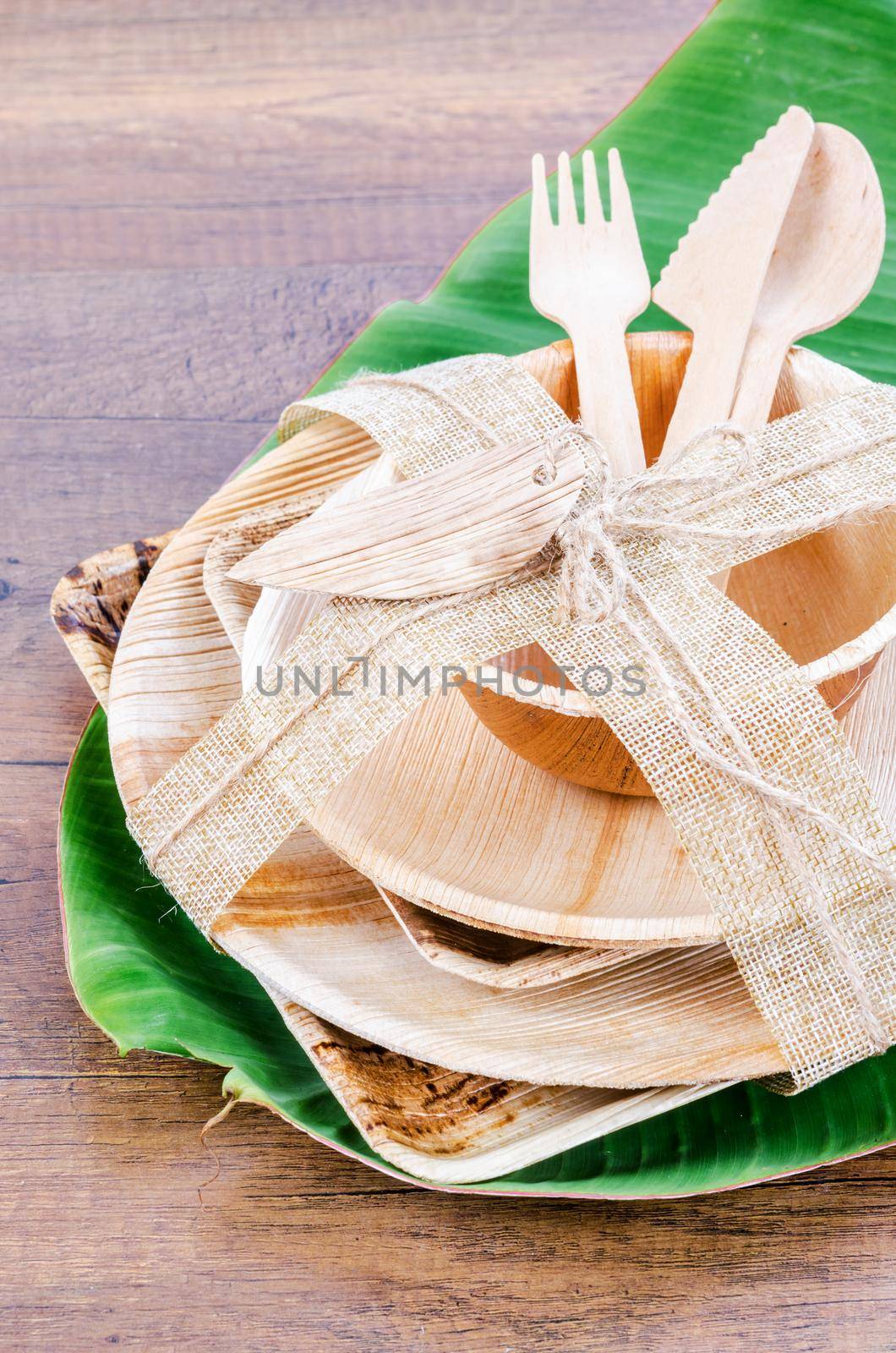 Kitchenware made from dried betel nut leaf palm, natural material. by Gamjai